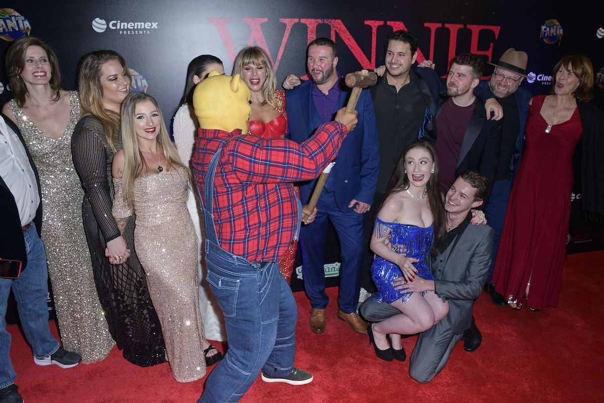 Andrew Scott, Natasha Tosini, Danielle Ronald, María Taylor, Vince Knight, Scott Jeffrey, Rhys Frake-Waterfield, Amber Doig-Thorne, Nikolai Leon, Craig David, and Danielle Scott pose for a photo during the red carpet on the movie 'Winnie The Pooh Blood and Honey'
