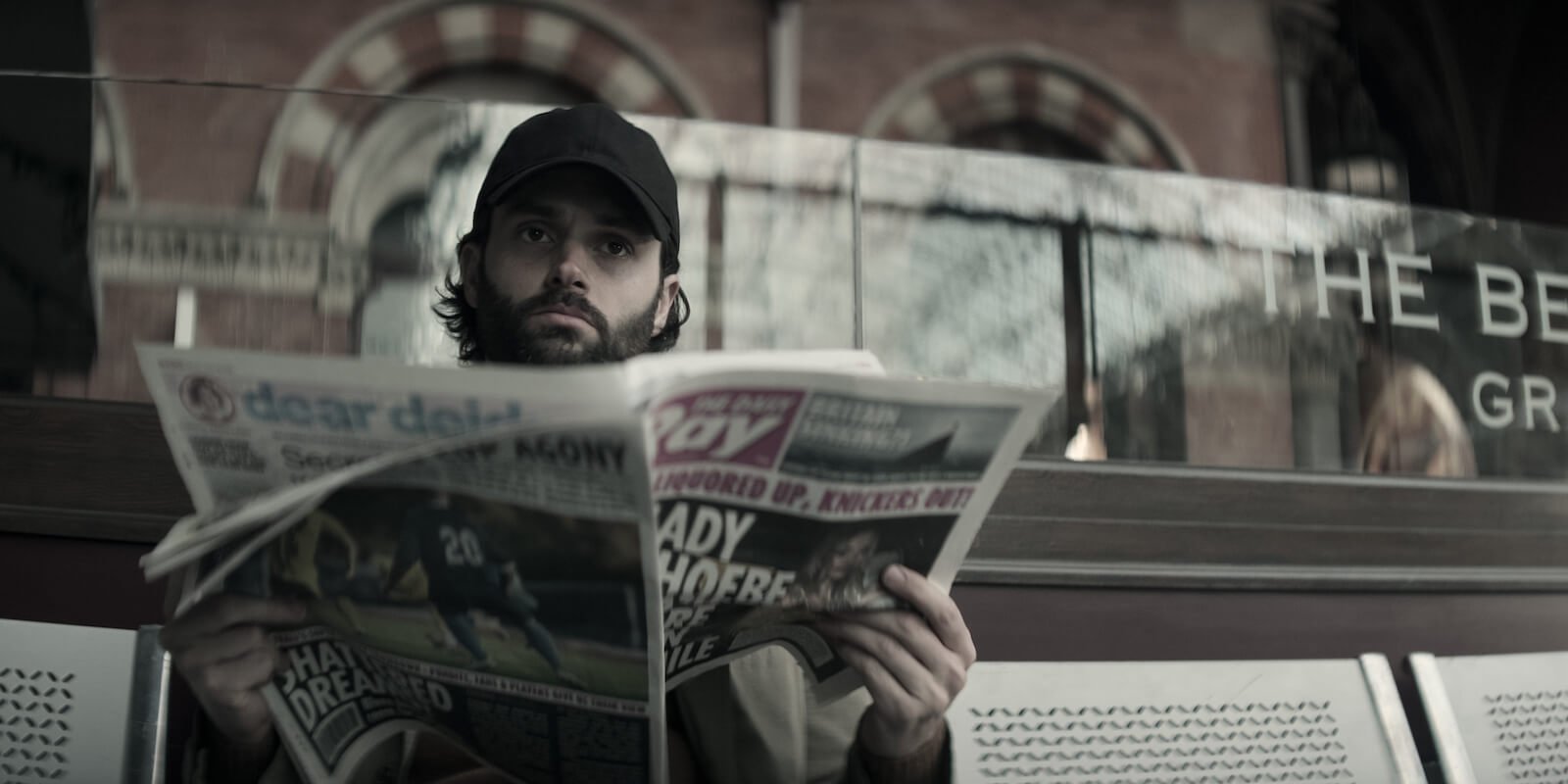 'You' Season 4: Joe (Penn Badgley) reads a newspaper