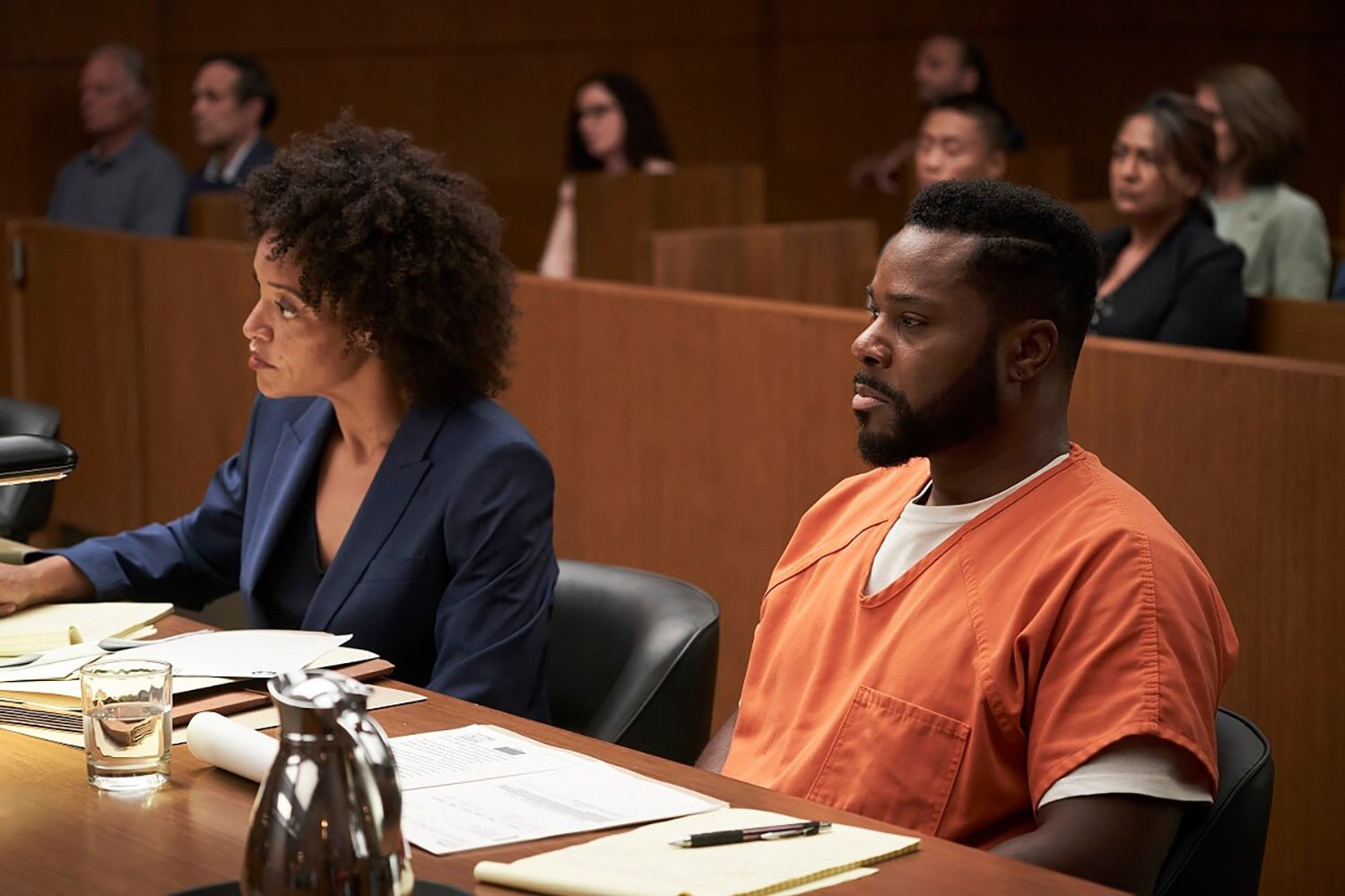 Jasmine Burns and Malcolm-Jamal Warner sitting in a courtroom in Accused Episode 4 on Fox