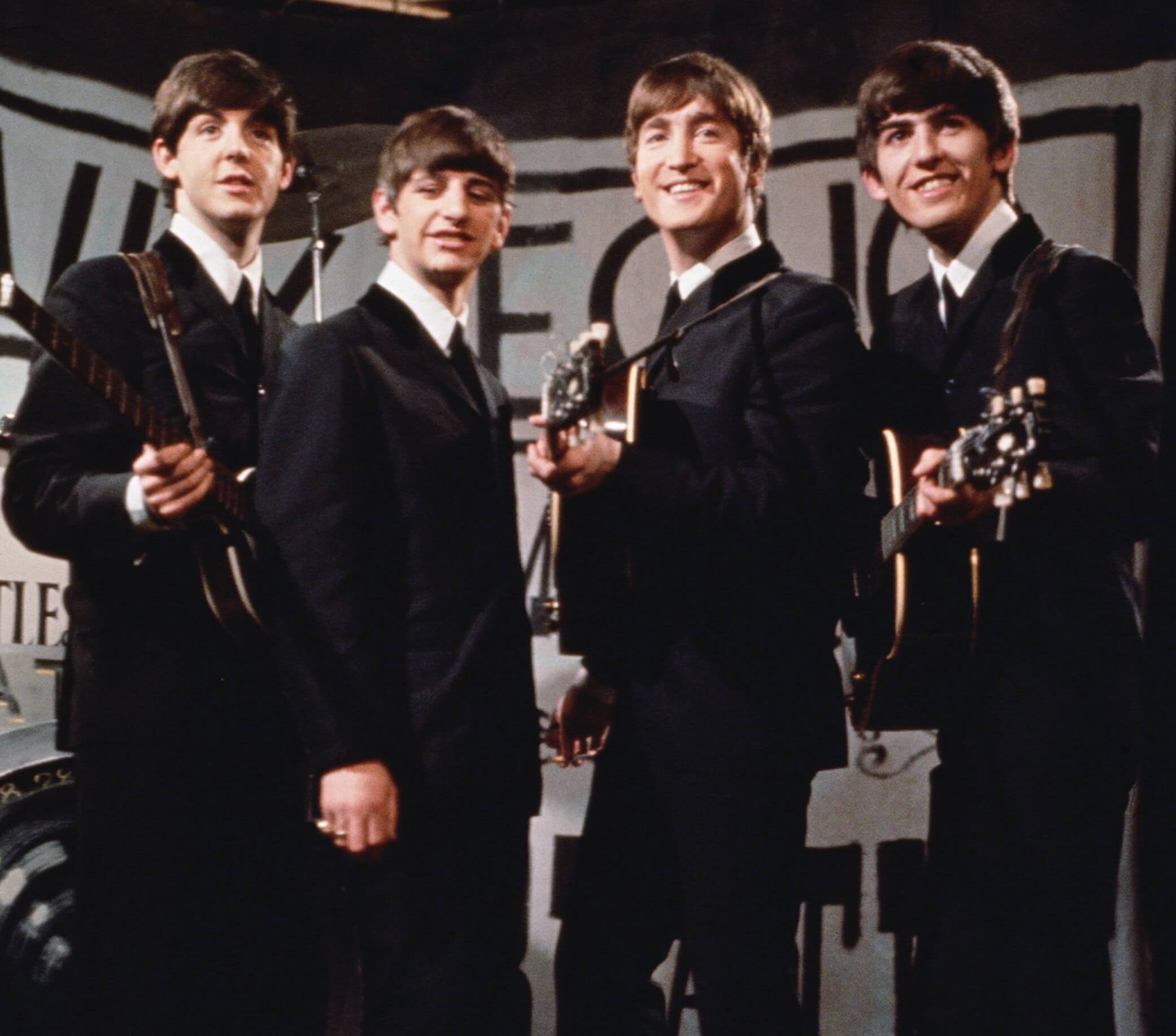 The Beatles wearing suits