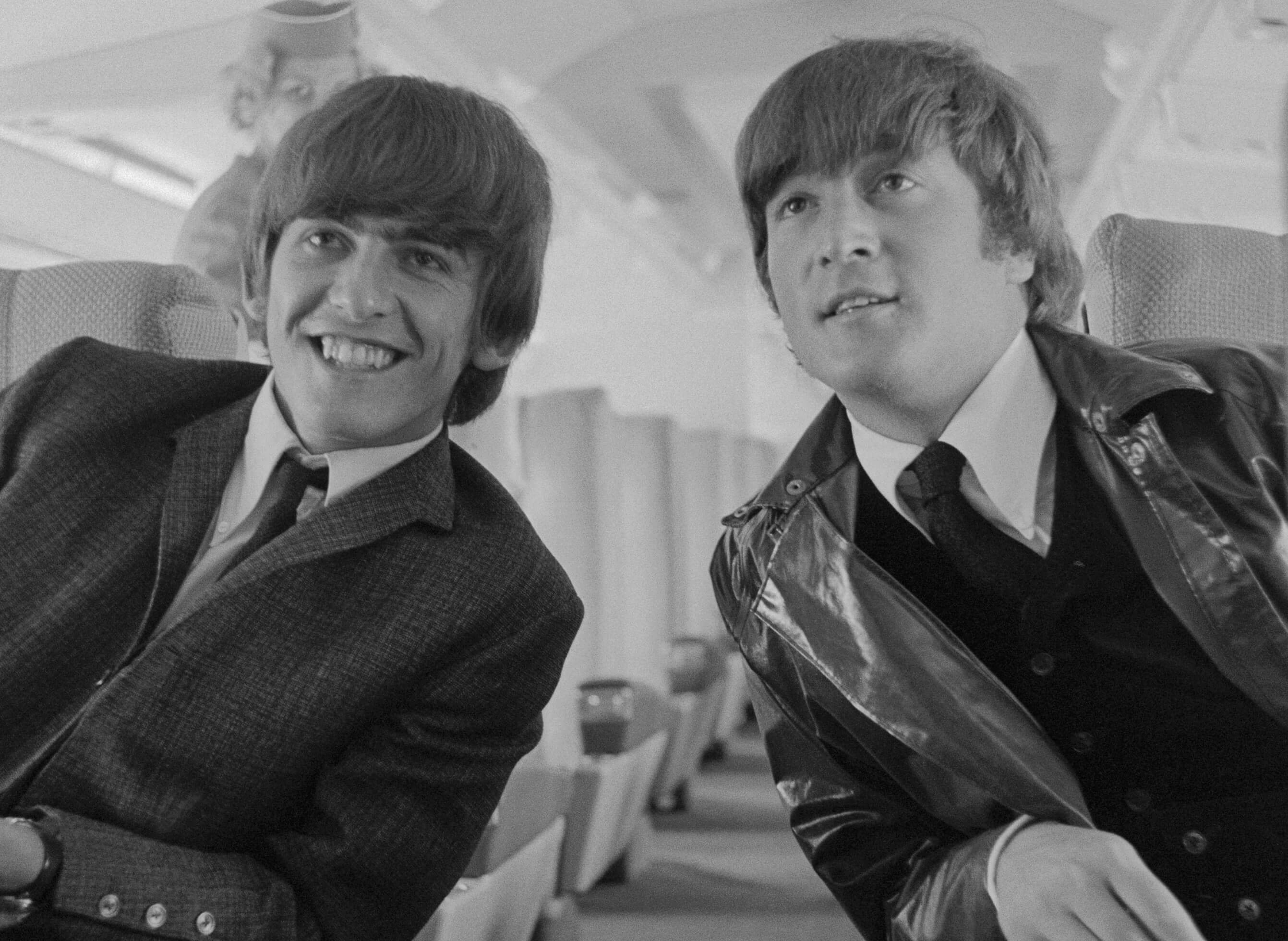 Classic rock stars George Harrison and John Lennon in black-and-white