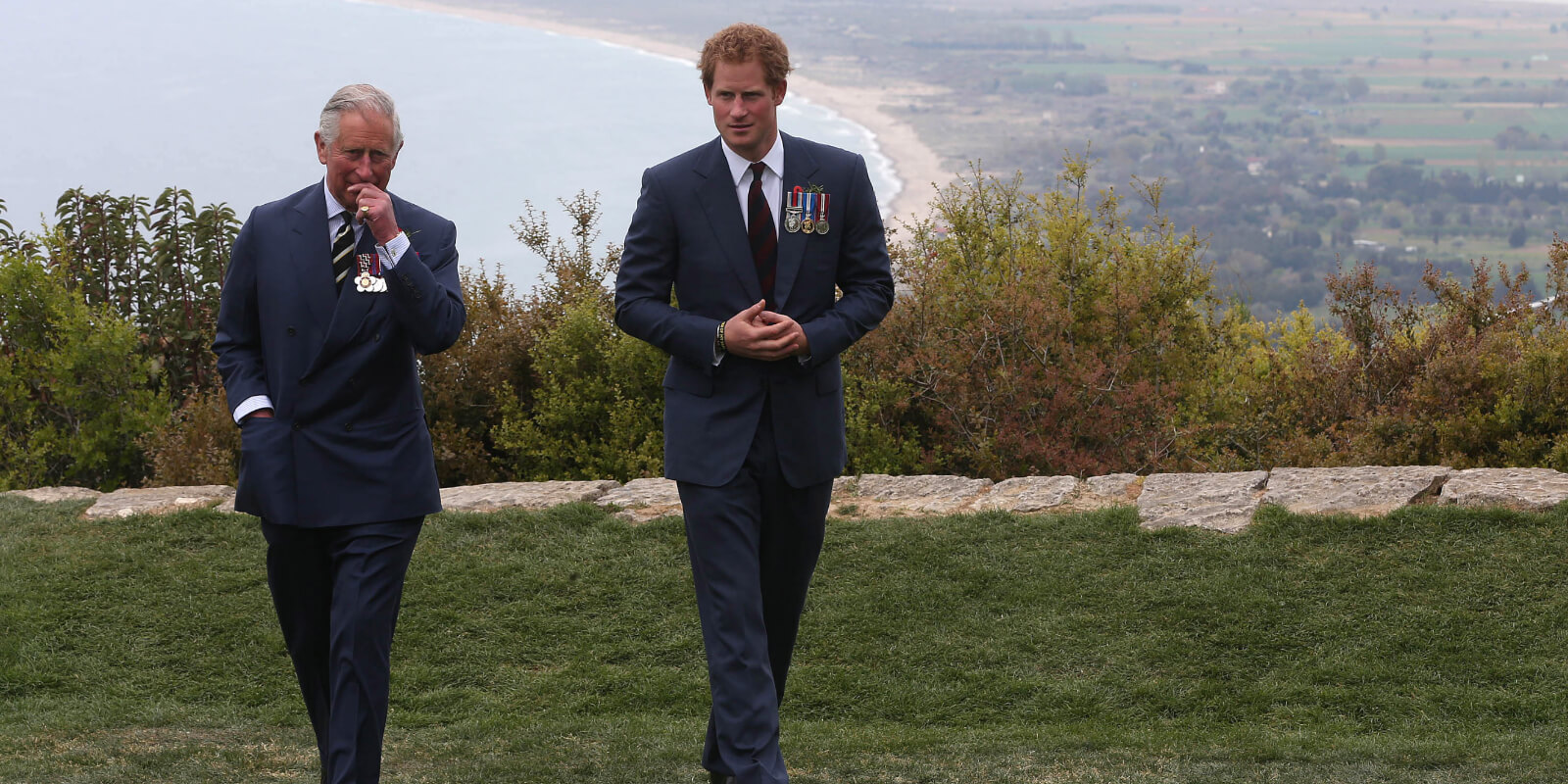 Prince Harry chats with Prince Charles, Prince of Wales during a visit to The Nek, a narrow stretch of ridge in the Anzac battlefield on the Gallipoli Peninsula, in 2015.