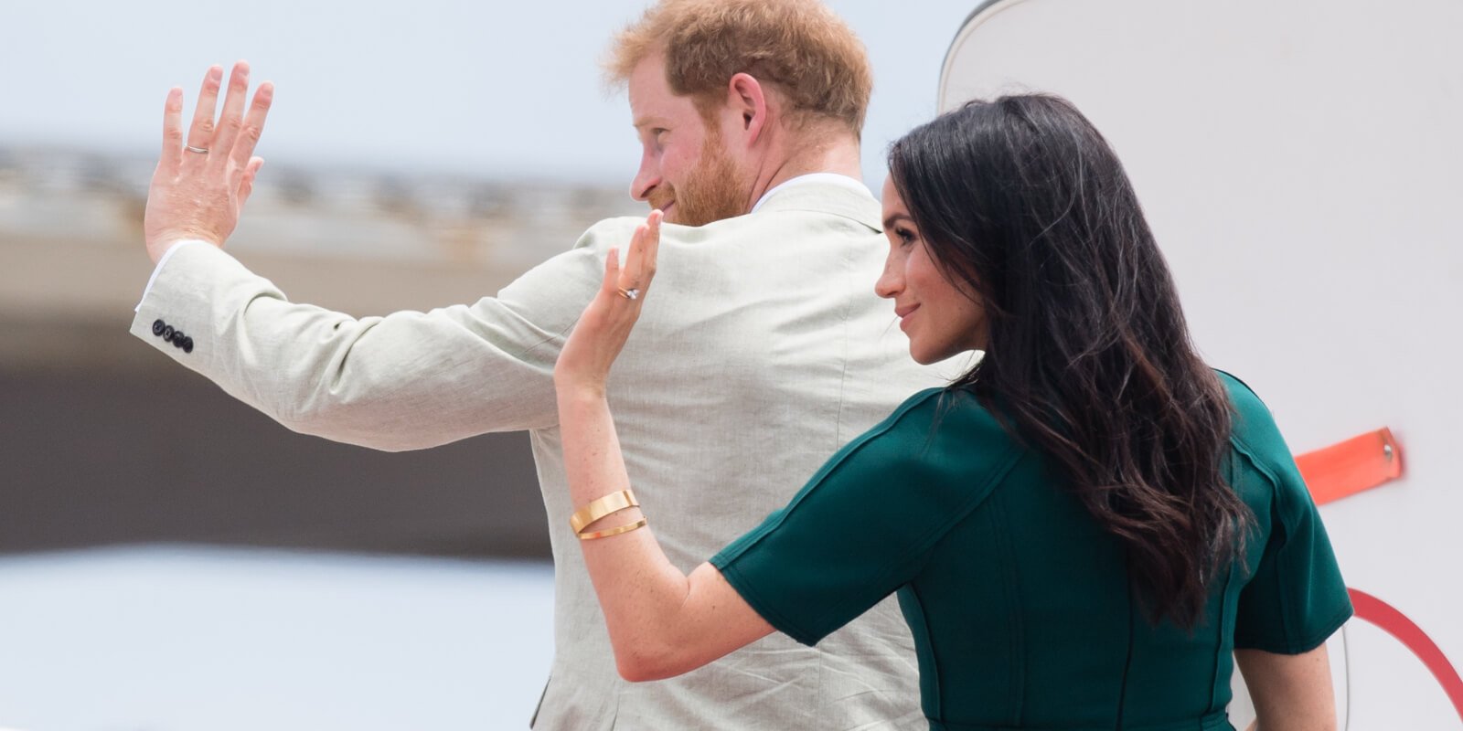 Prince Harry and Meghan Markle wave as they depart from Nadi airport on October 25, 2018 in Nadi, Fiji.