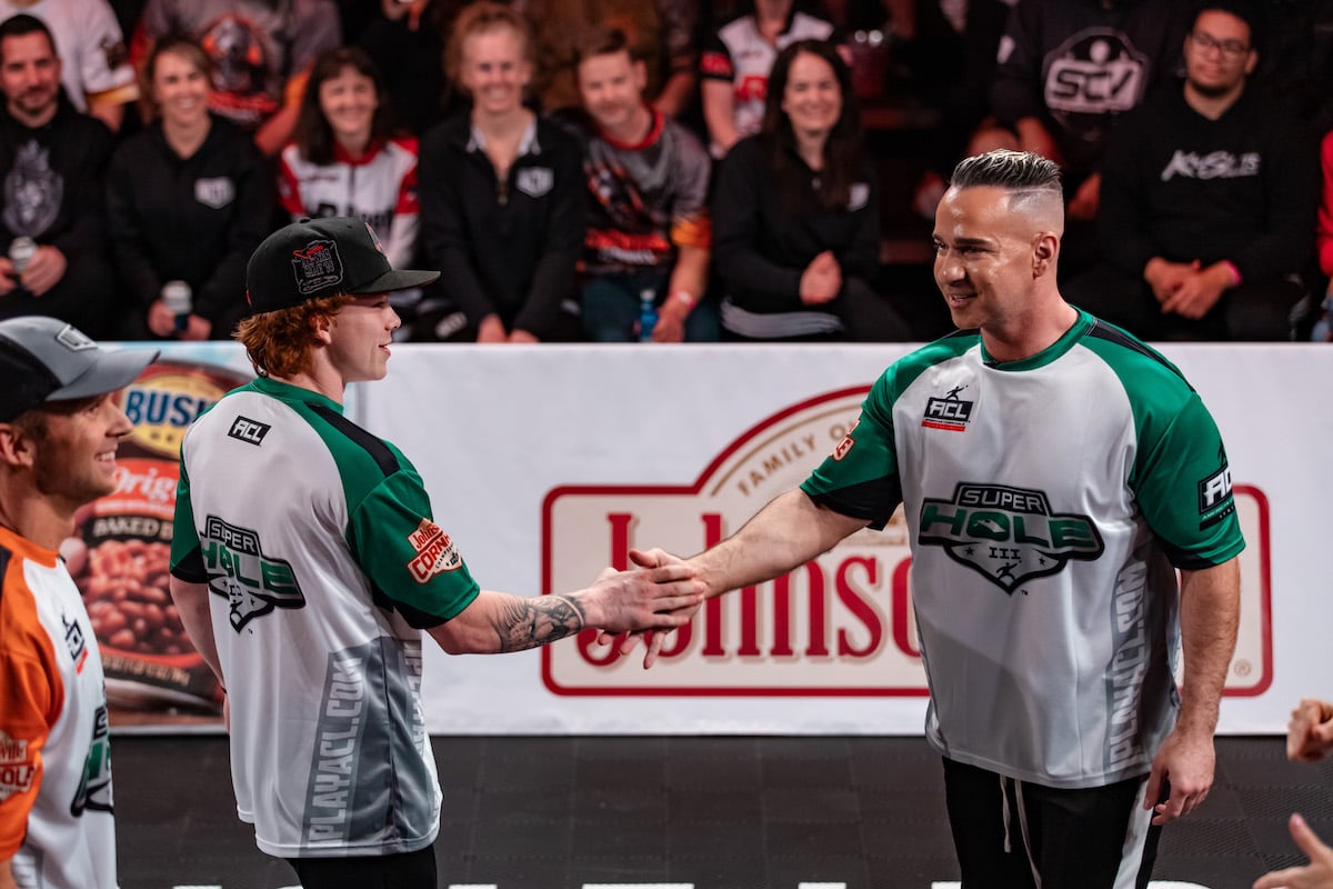 American Cornhole League pro Jacob Trzcienski and Mike 'The Situation' Sorrentino at the SuperHole III Championship in 2022