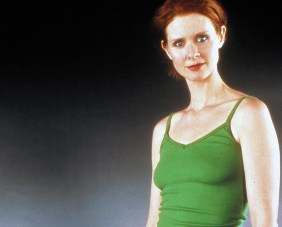 Cynthia Nixon wearing a green shirt poses for a promotional photo for 'Sex and the City'