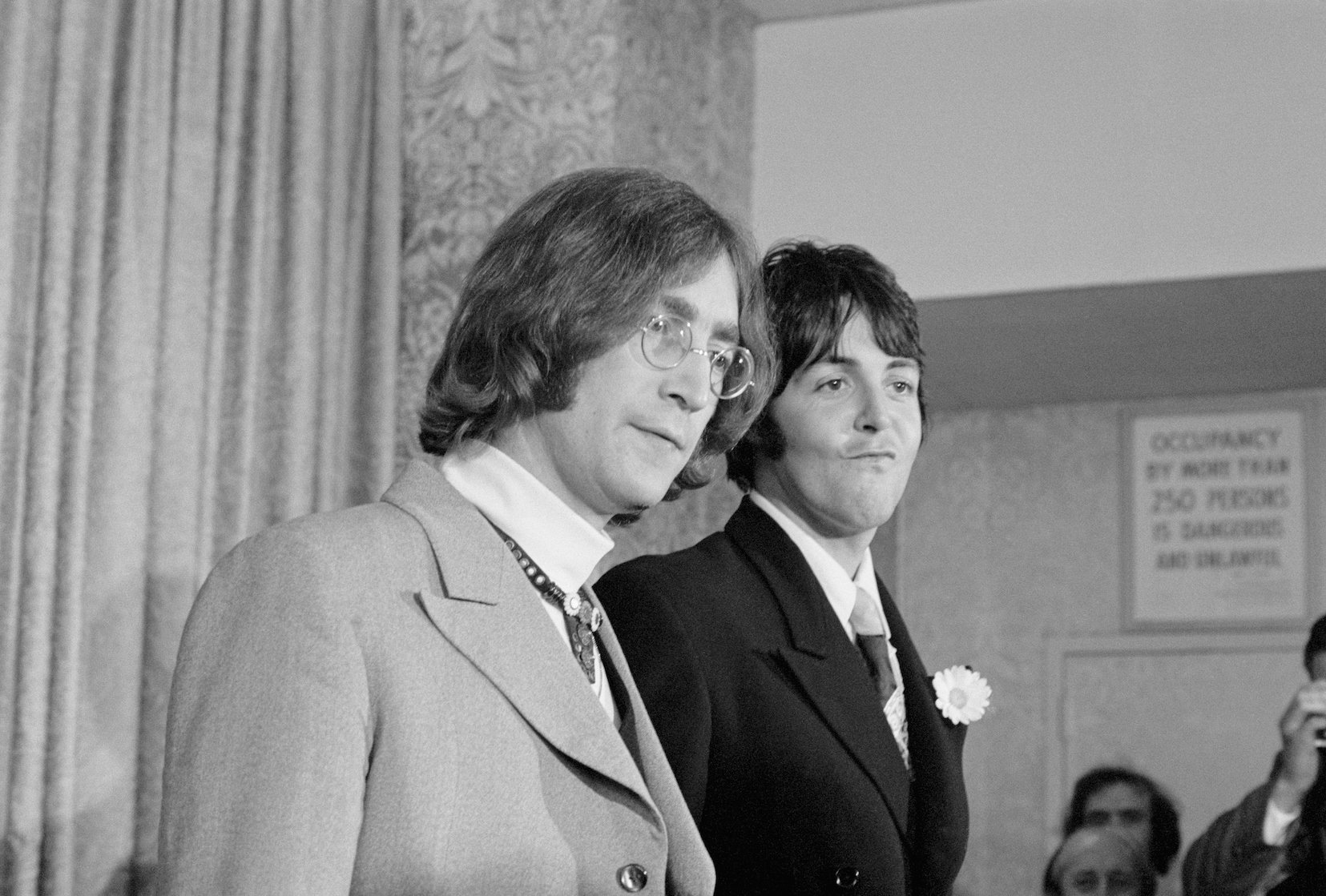 John Lennon and Paul McCartney attend a press conference announcing Apple Corps.