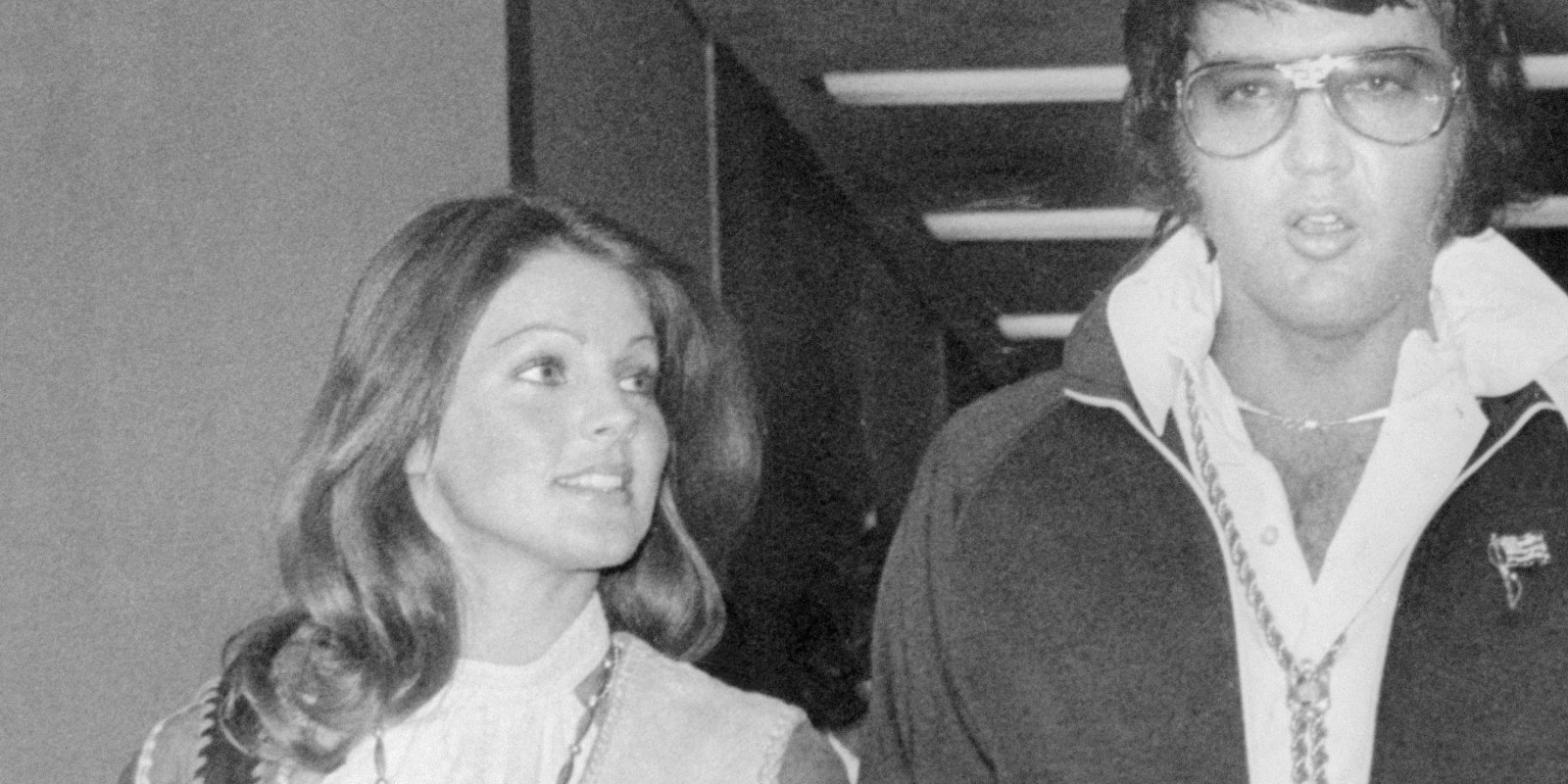 Priscilla Presley and Elvis Presley pose as they leave the courthouse following their divorce hearing.
