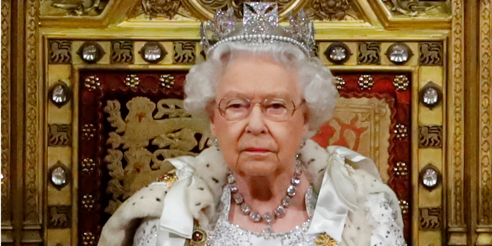 Britain's Queen Elizabeth II (L) takes her seat on the The Sovereign's Throne in the House of Lords in 2019.