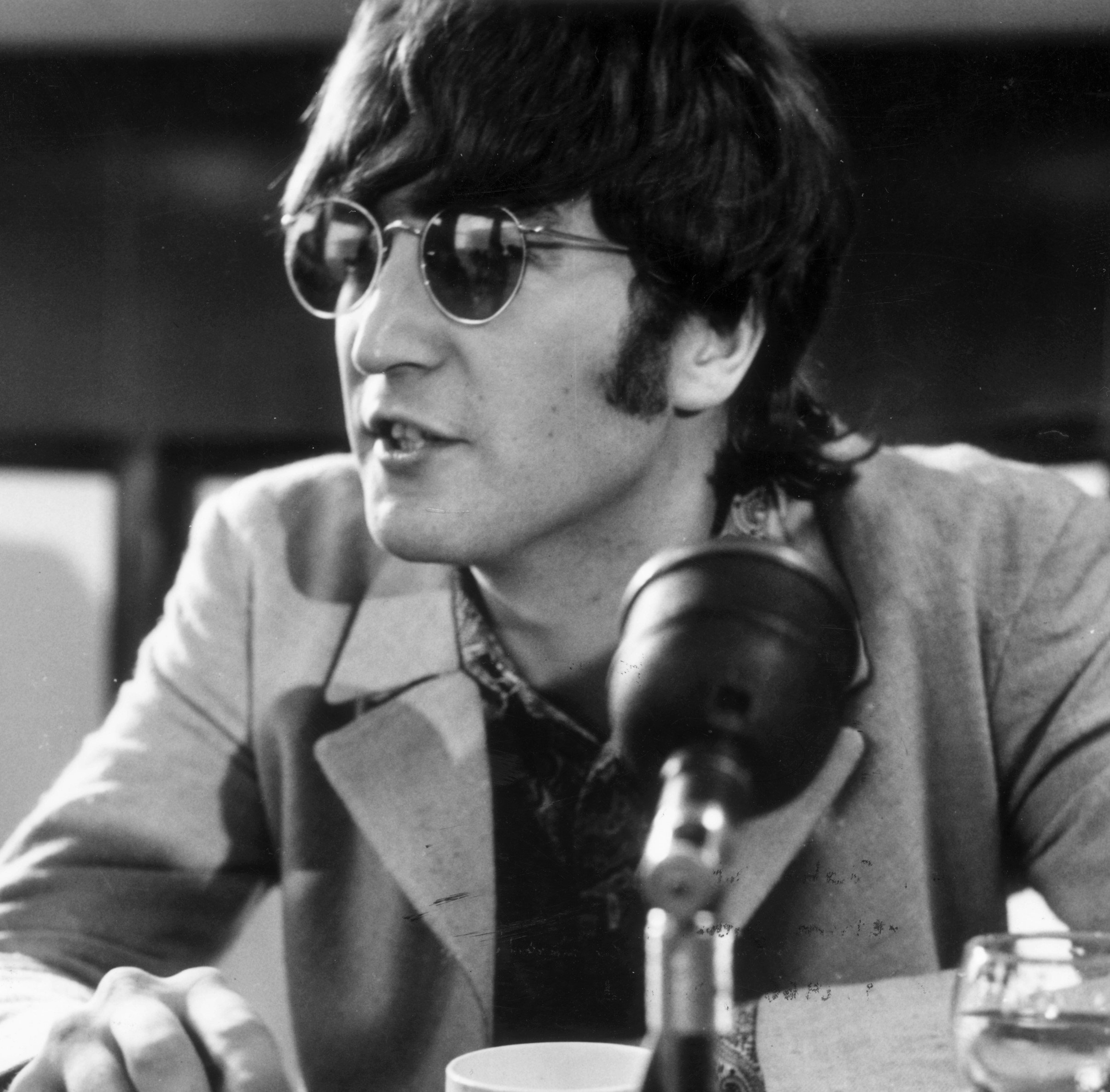 John Lennon wearing dark glasses