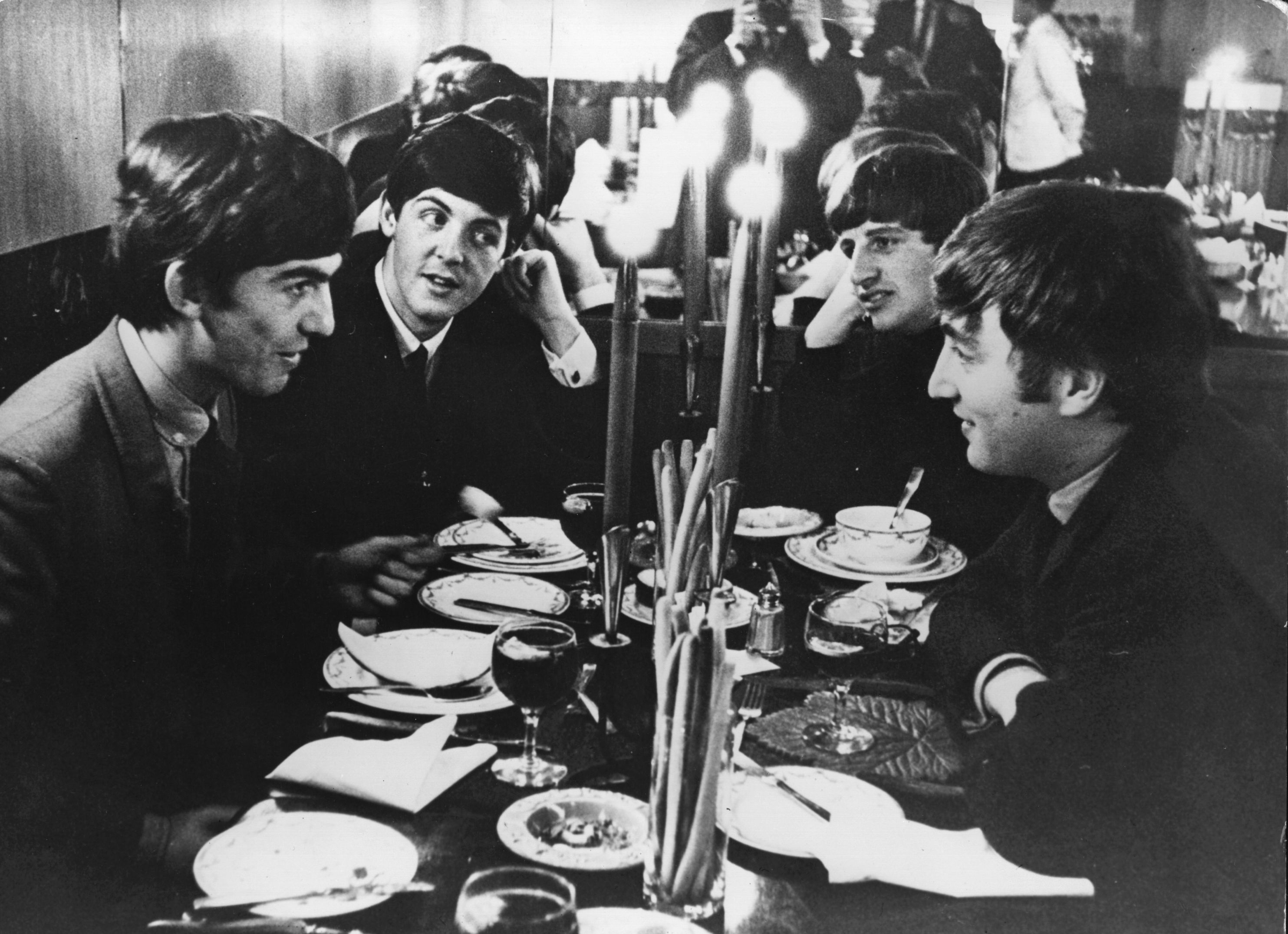 The Beatles meet for the first time after their holidays by candlelight at the Star Steak House in Shaftsbury Avenue