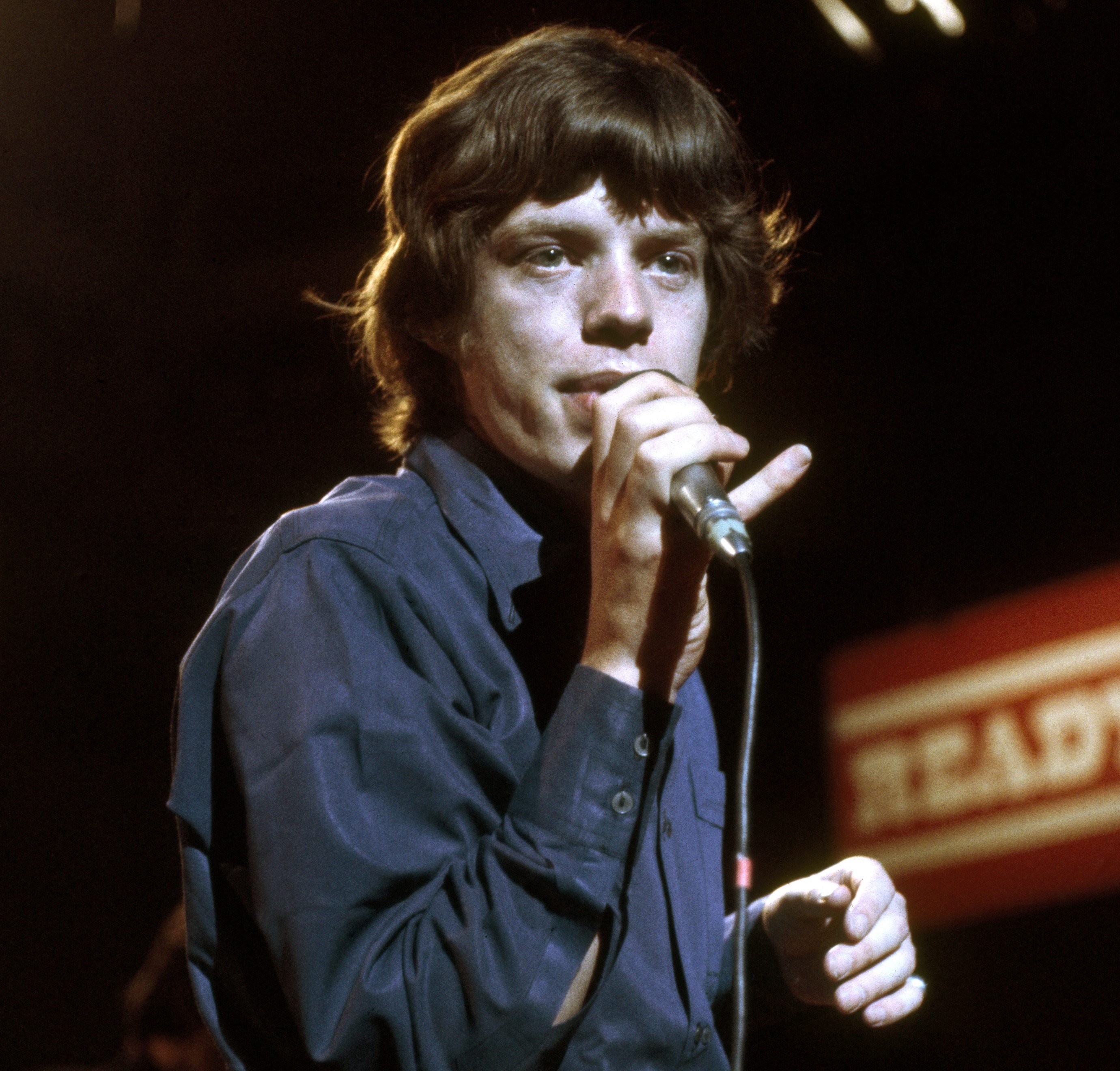 Mick Jagger with a microphone during The Rolling Stones' 'Beggars Banquet' era