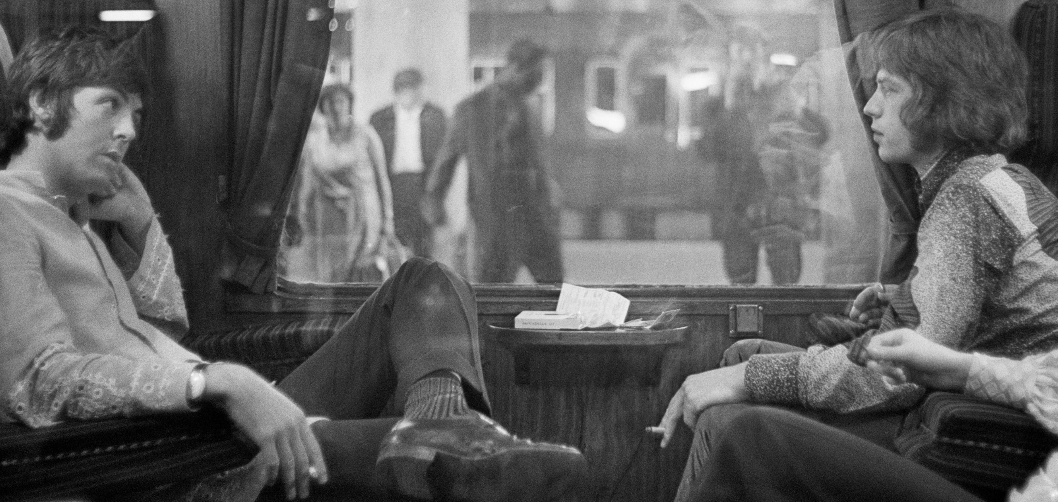 Paul McCartney and Mick Jagger on a train during The Rolling Stones' "Paint It Black" era