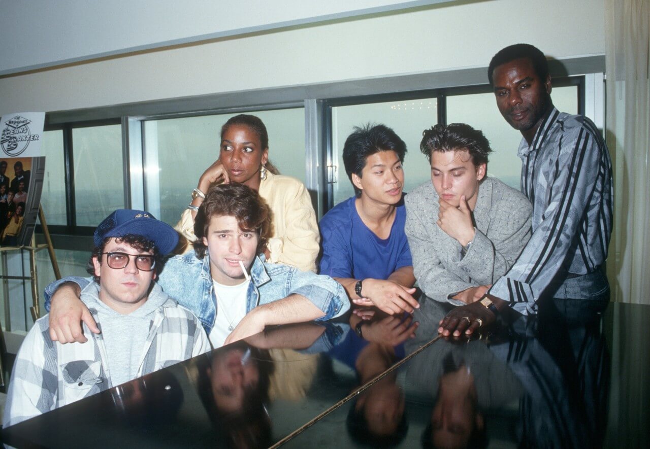 The cast of Fox's '21 Jump Street' sit at a piano. 
