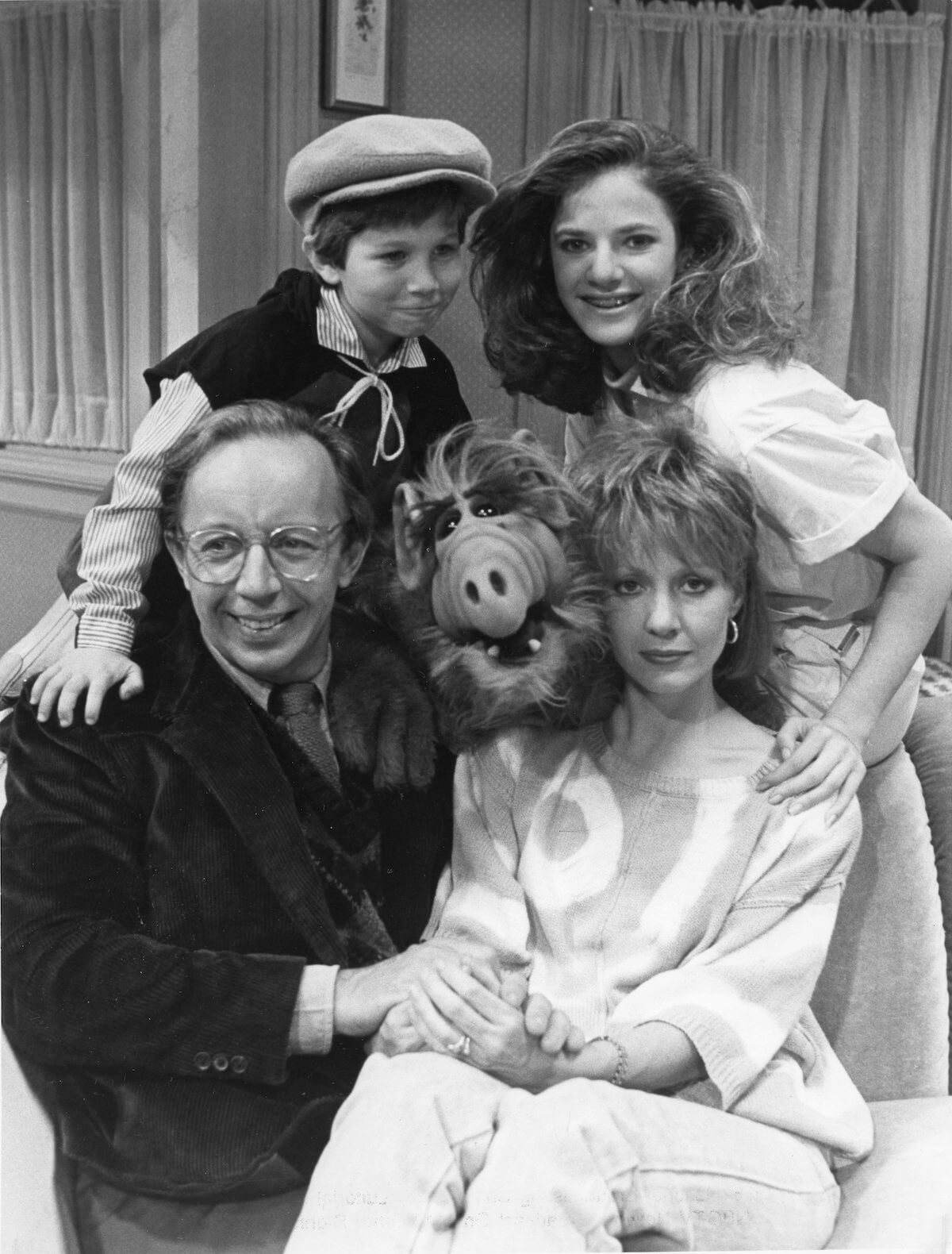 ALF sits between his costars