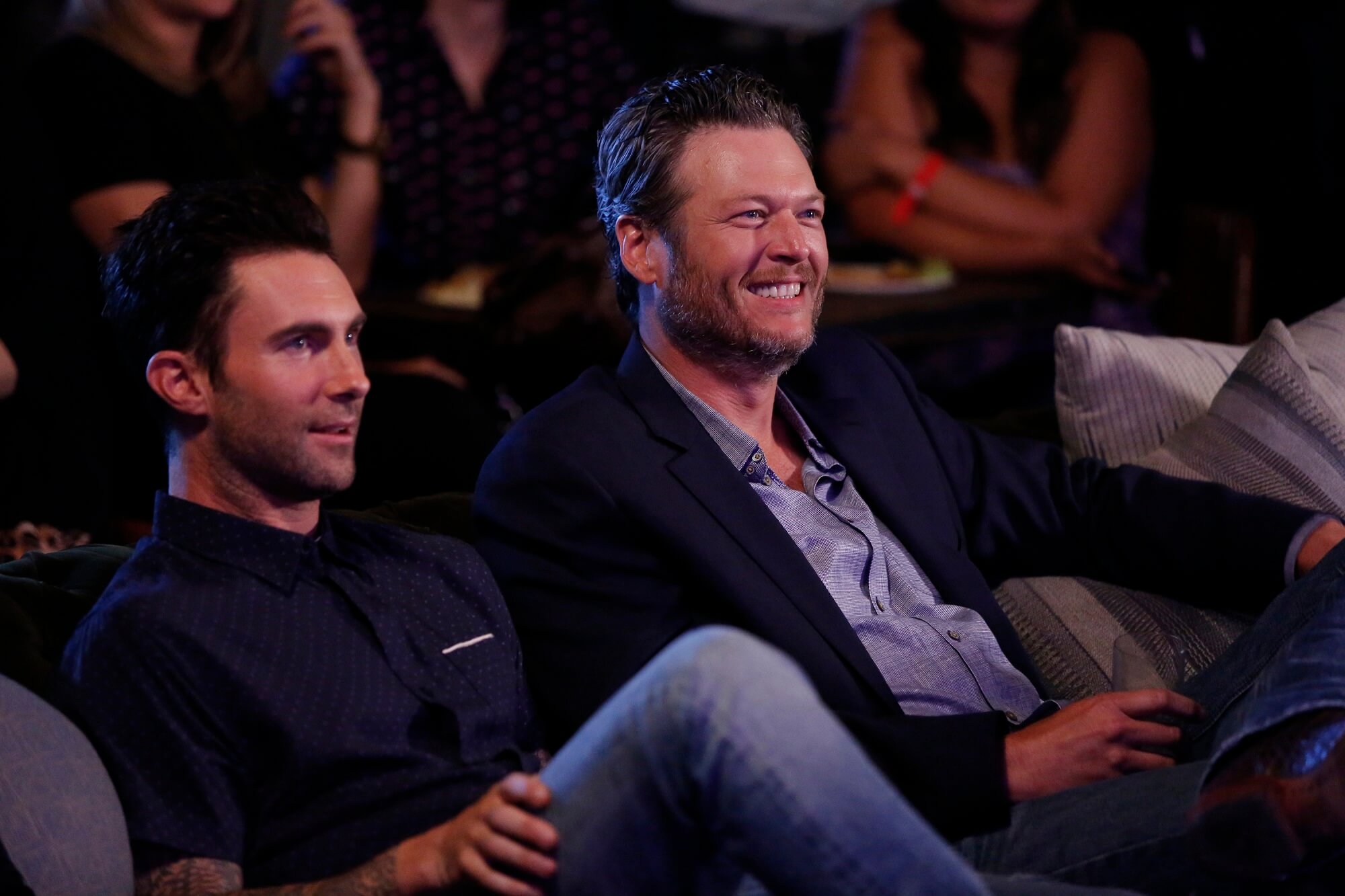 Adam Levine and Blake Shelton sit together side by side