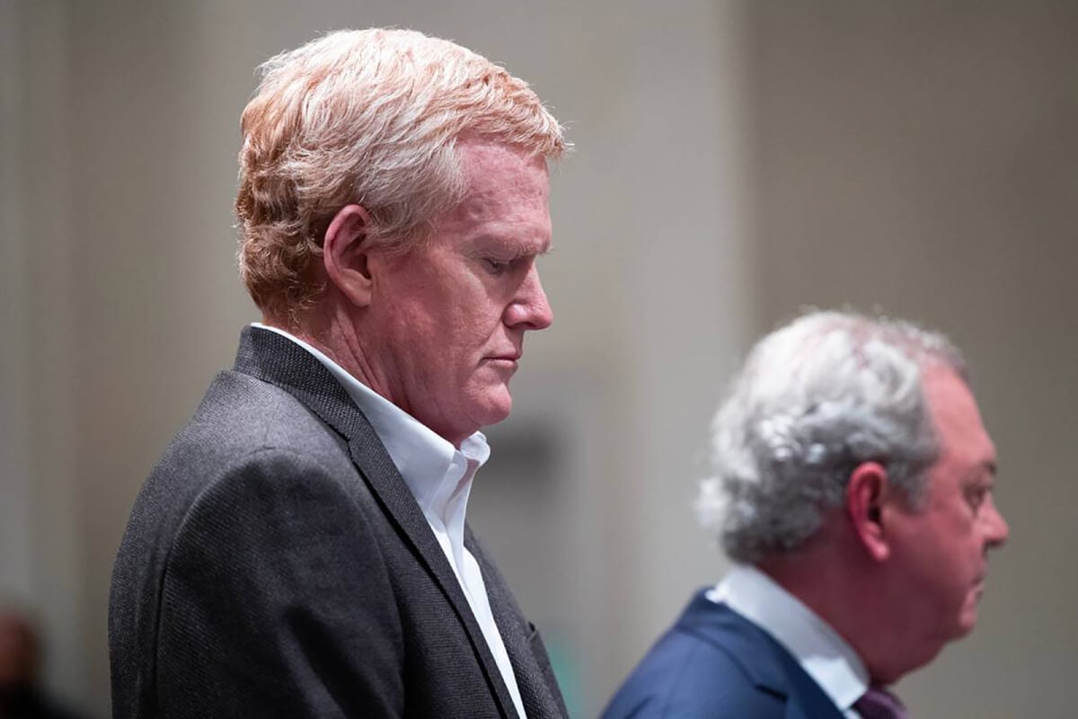 Alex Murdaugh at his sentencing, wearing a white shirt and black suit jacket.