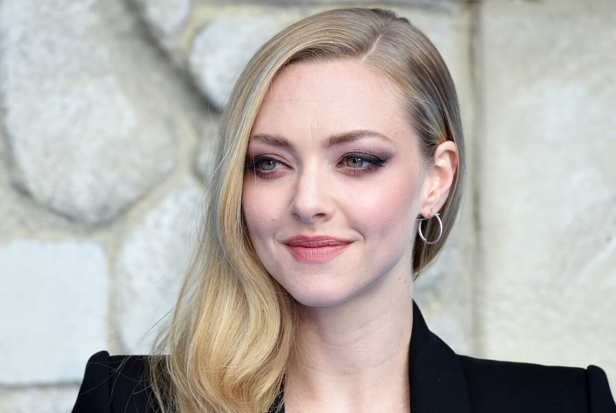Amanda Seyfried looking off to the side and smiling