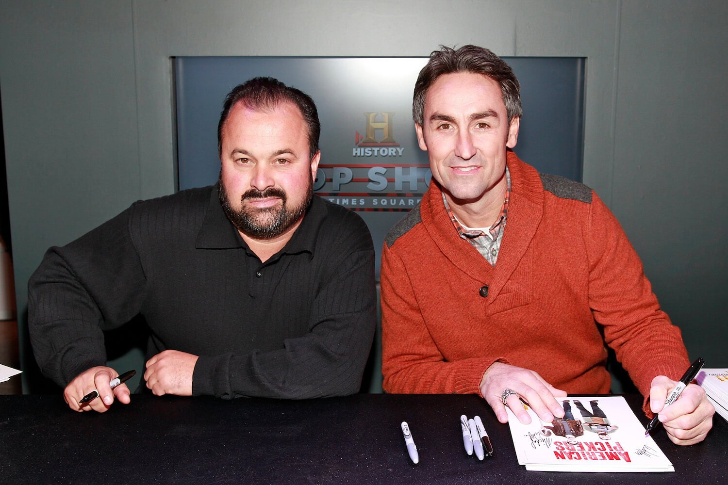 'American Pickers' stars Frank Fritz and Mike Wolfe sitting next to each other and smiling