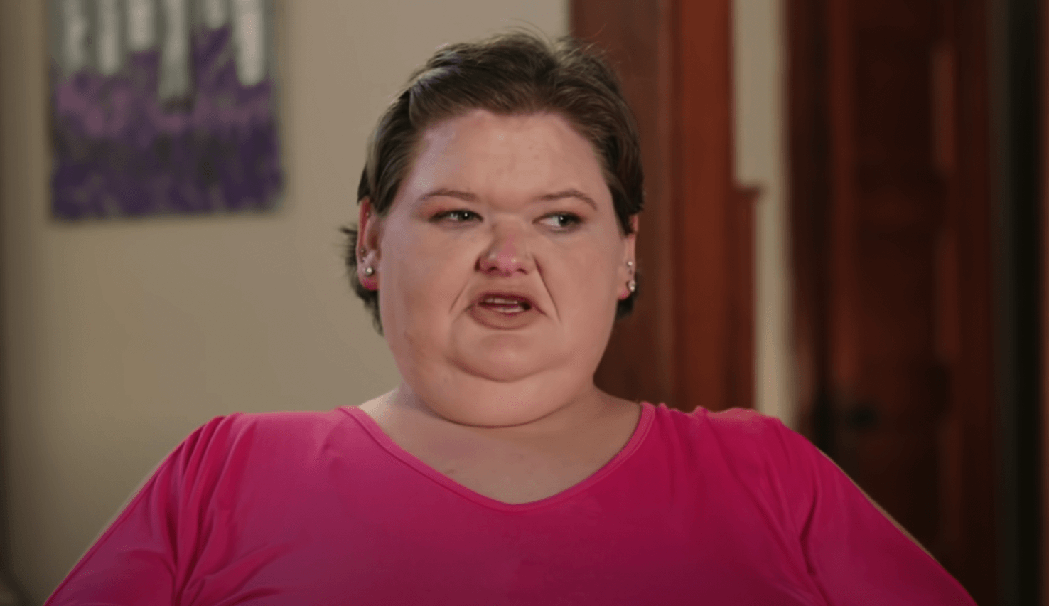 Amy Slaton speaking to the cameras in a pink shirt in '1000-Lb. Sisters'