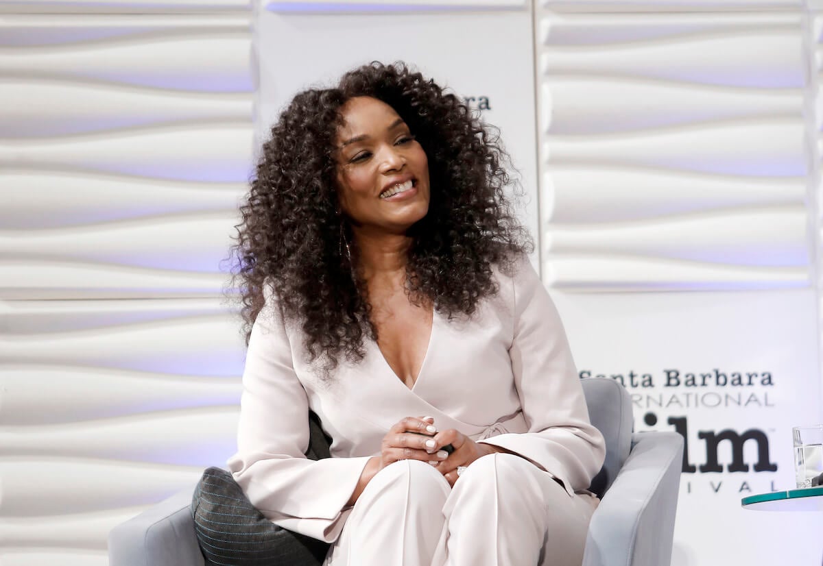 Angela Bassett sitting and smiling