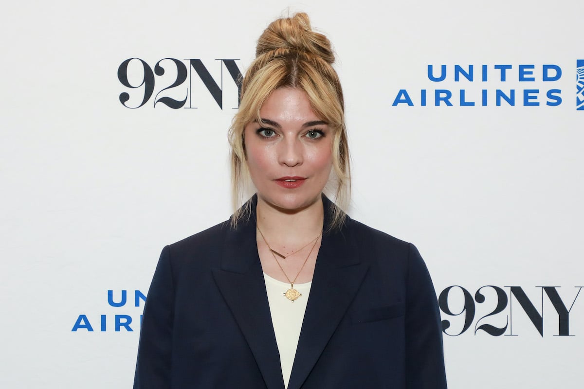 Annie Murphy in a black blazer and white top