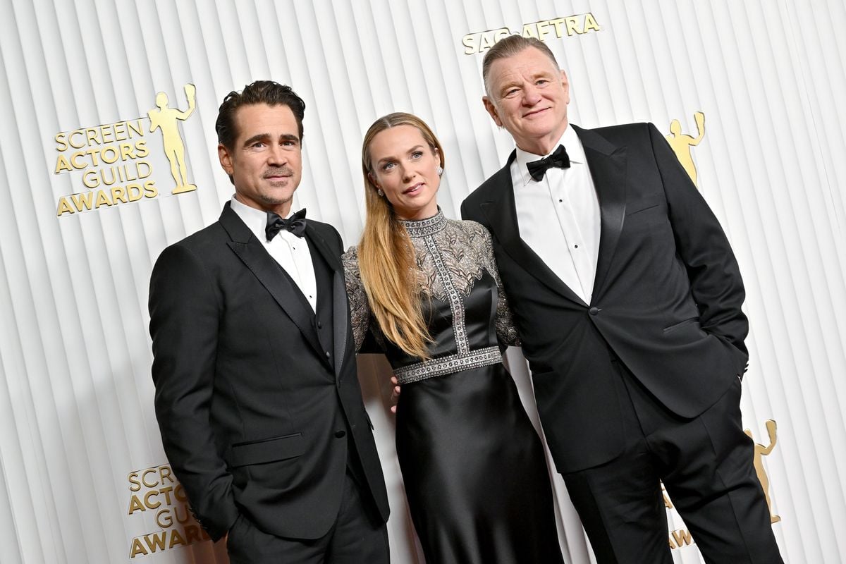 Colin Farrell, Kerry Condon, and Brendan Gleeson pose for a photo at the SAG awards in front of a white backdrop.