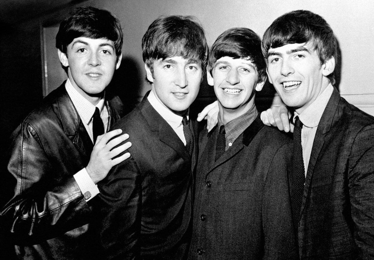 Beatles members Paul McCartney (from left), John Lennon, Ringo Starr, and George Harrison smile in a group photo from June 1963.