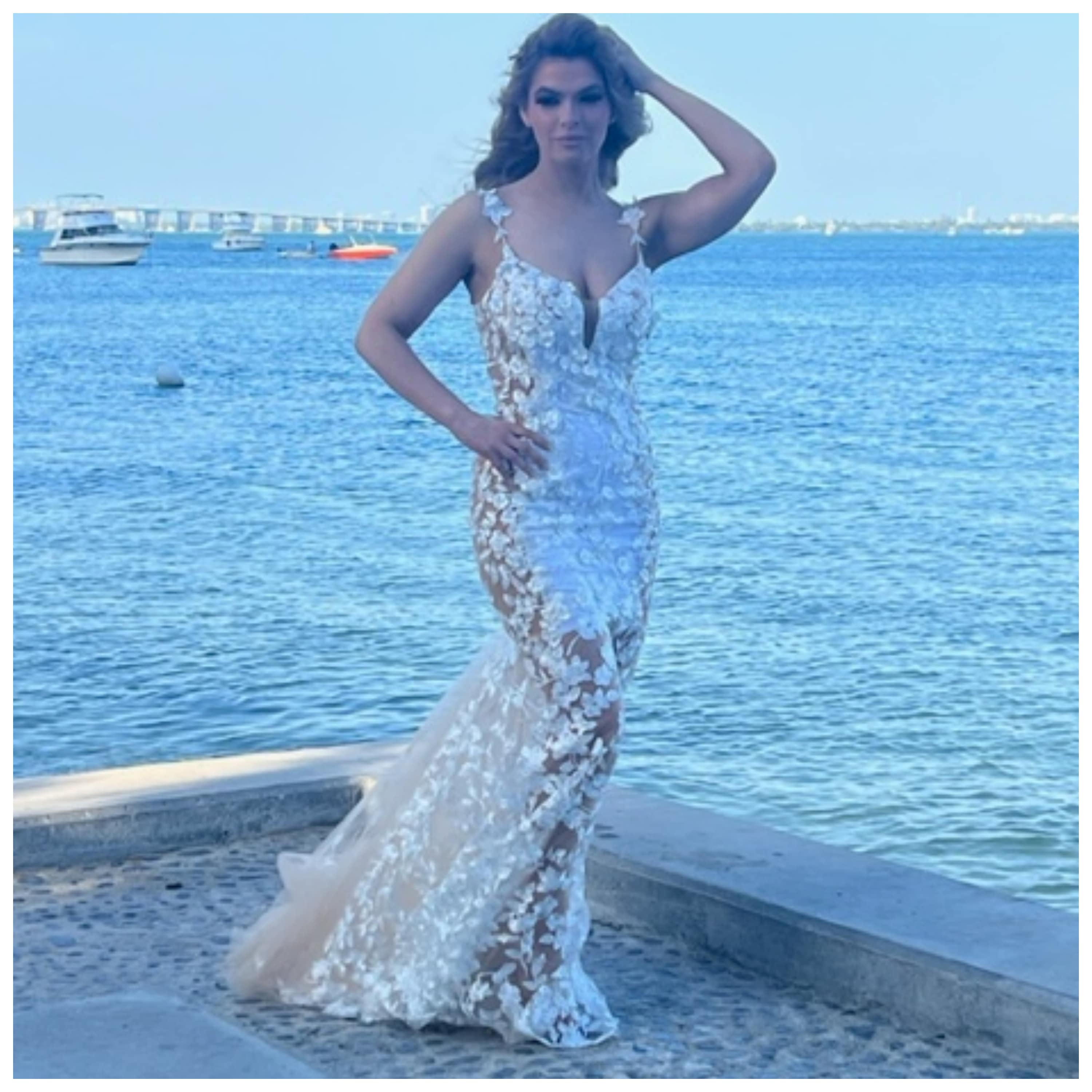 Kasey Cohen from 'Below Deck' models a white gown.