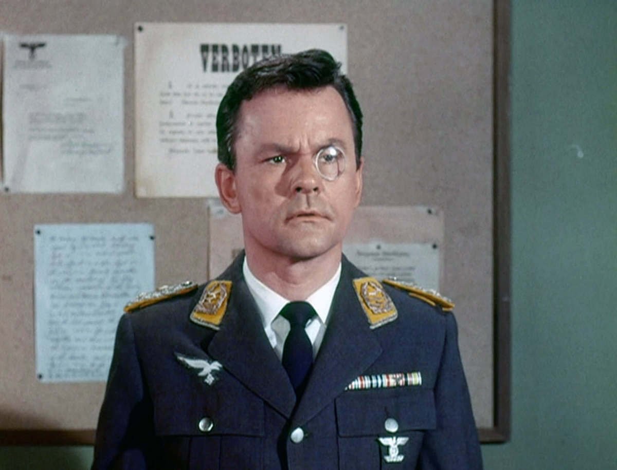 Bob Crane as Col. Robert E. Hogan (dressed as Col. Klink)