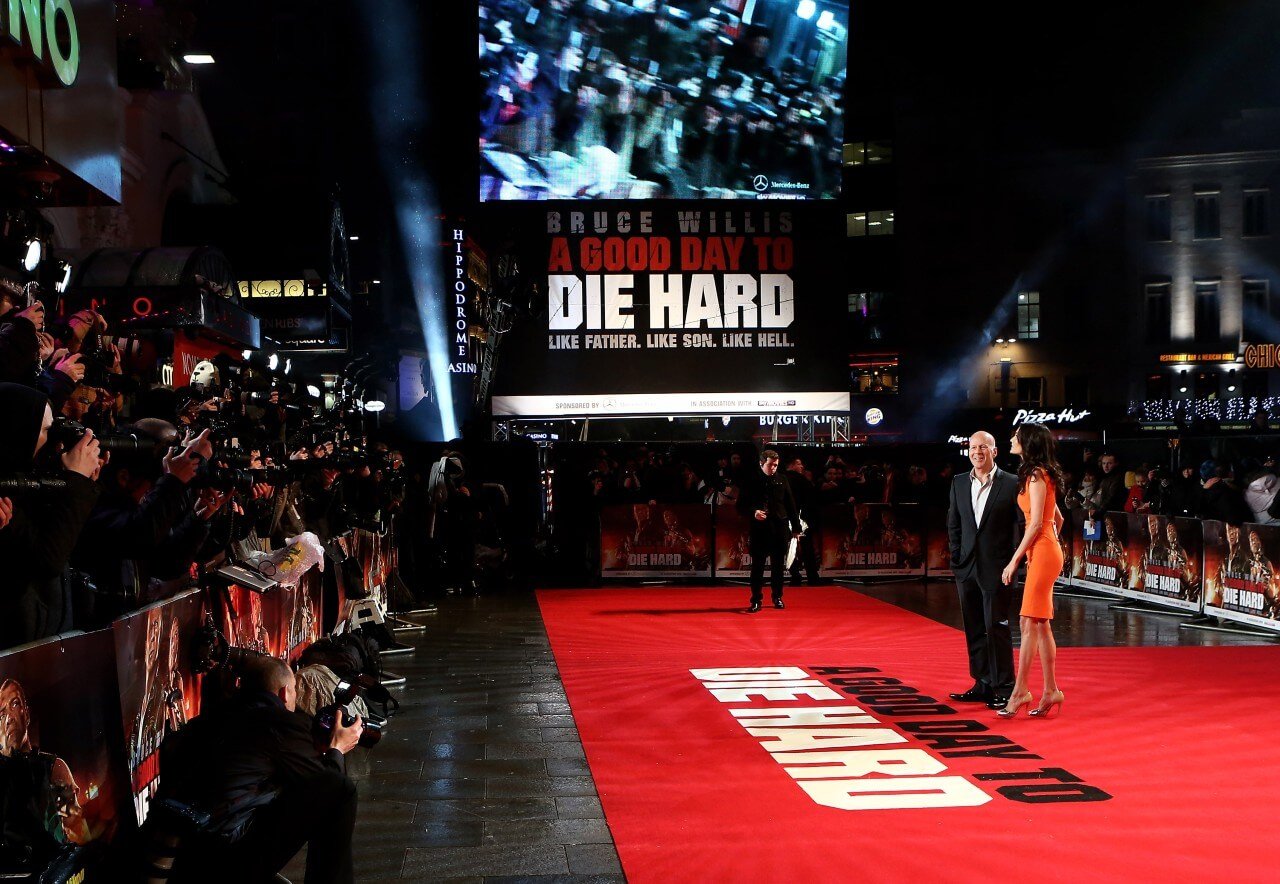 Bruce Willis attends a 'Die Hard' event with his wife. 