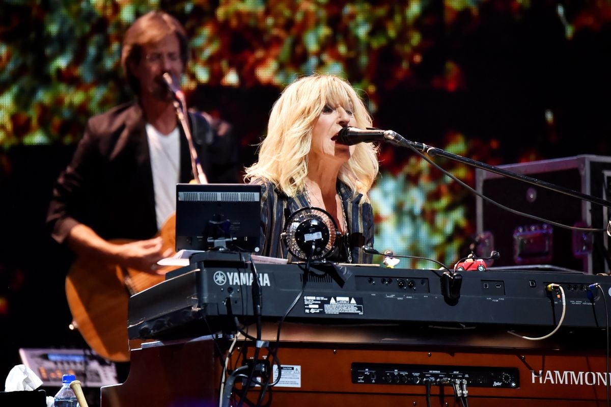 Christine McVie performs onstage in 2018.