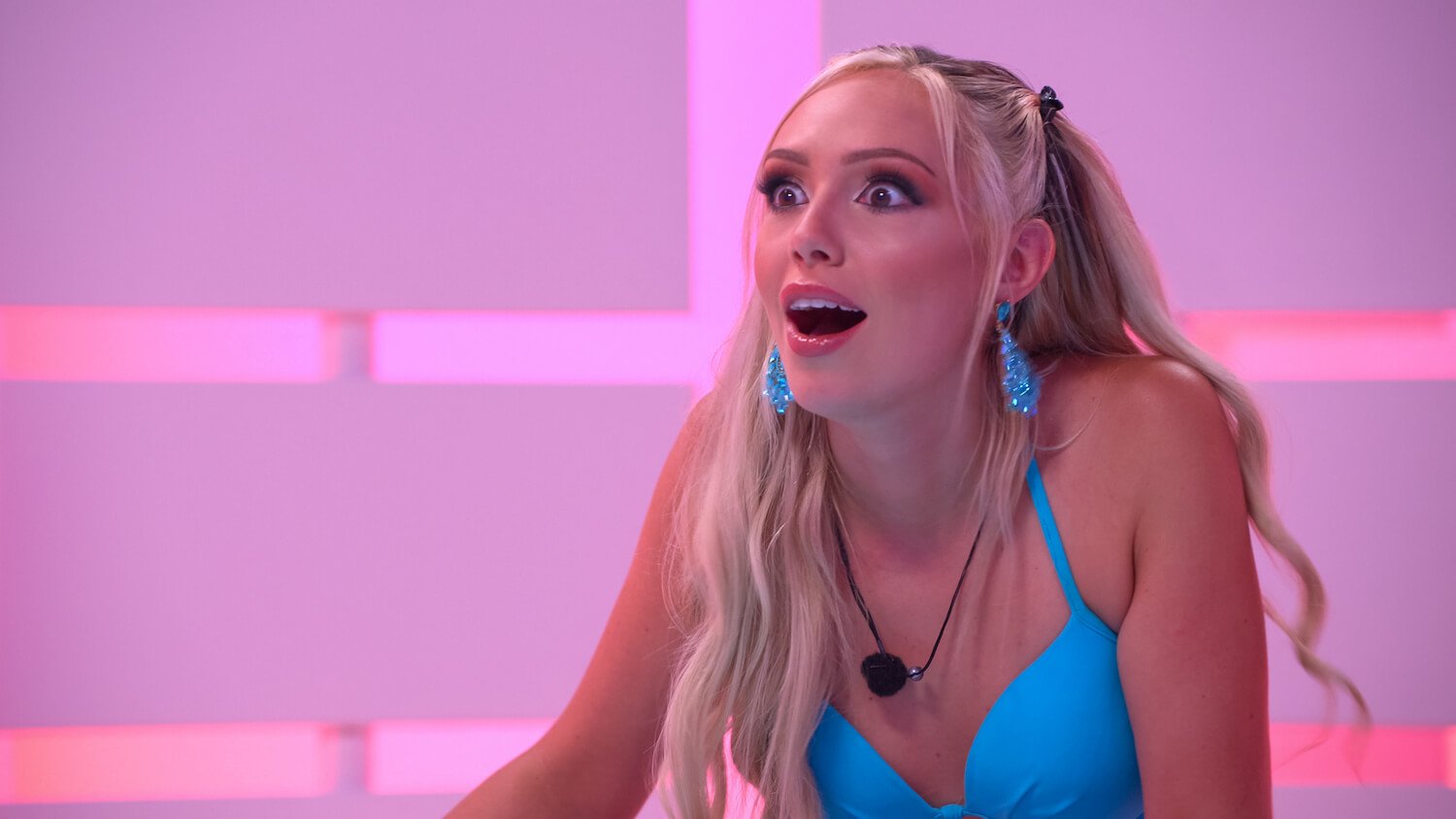 'Perfect Match' star Kariselle Snow wearing a blue bikini top and blue earrings. Here are the cringiest moments from 'Perfect Match.