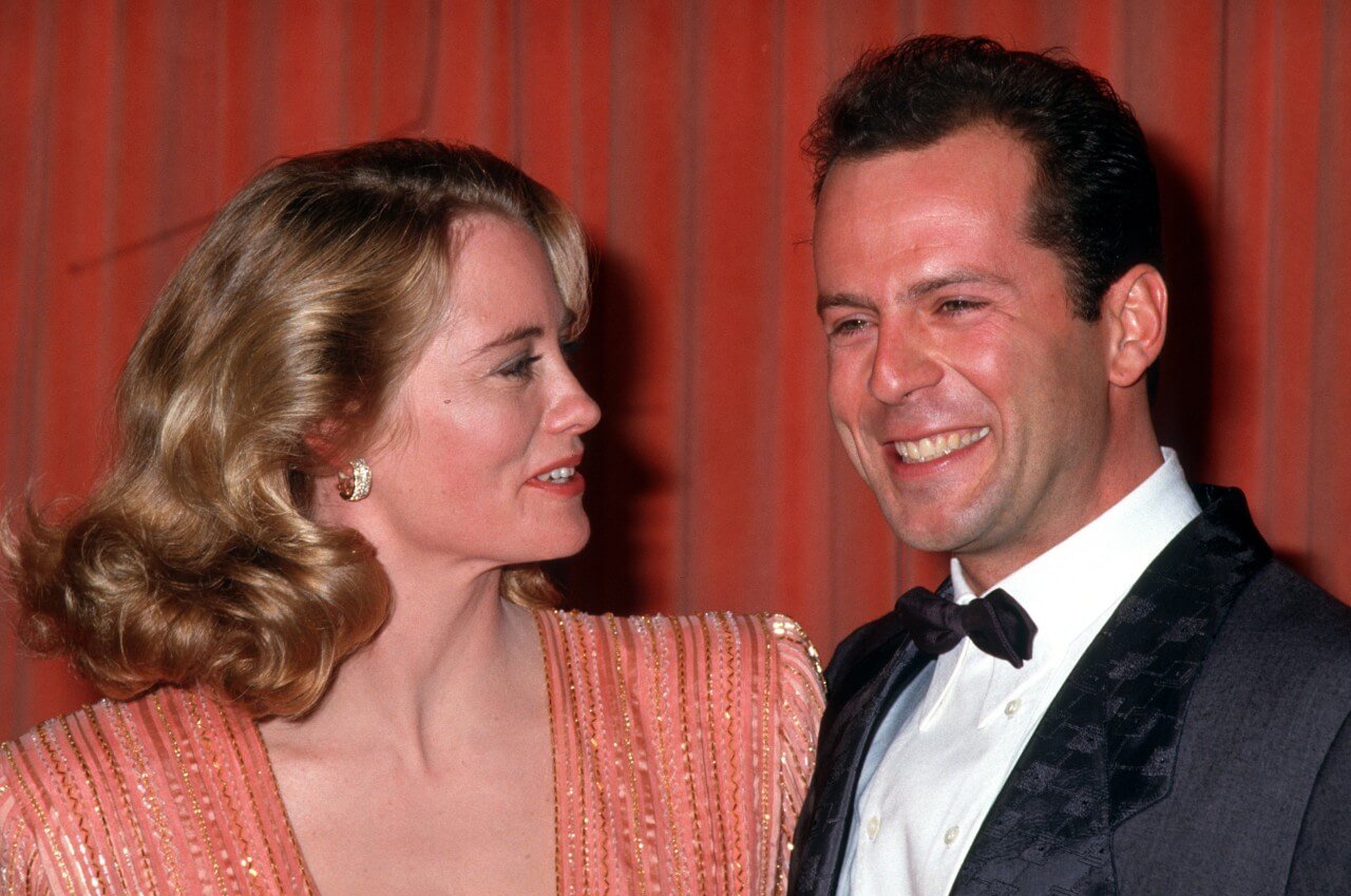 Cybill Shepherd and Bruce Willis smile during an awards ceremony.