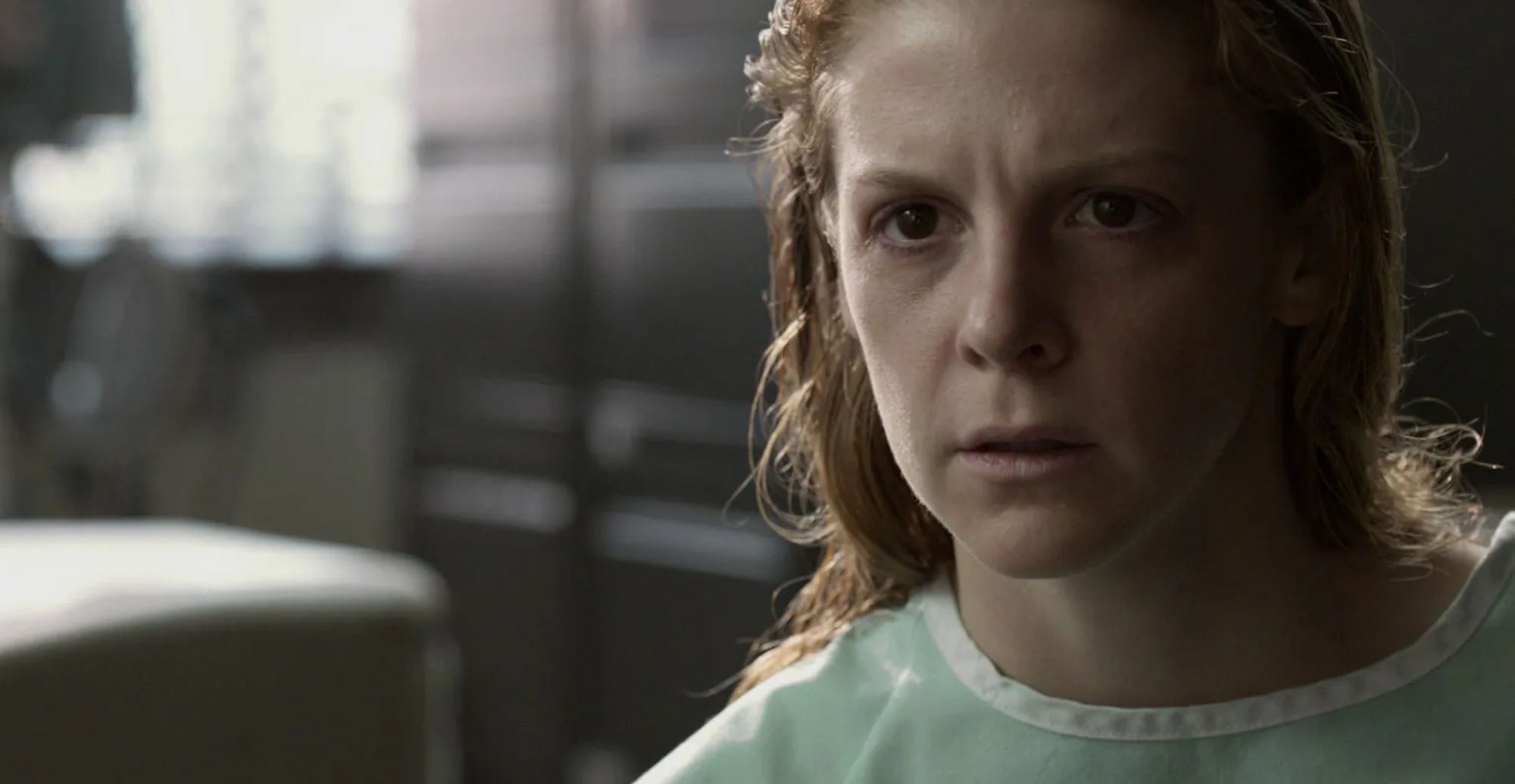 Damien Chazelle horror movie 'The Last Exorcism II' Ashley Bell as Nell looking surprised, wearing a hospital gown.