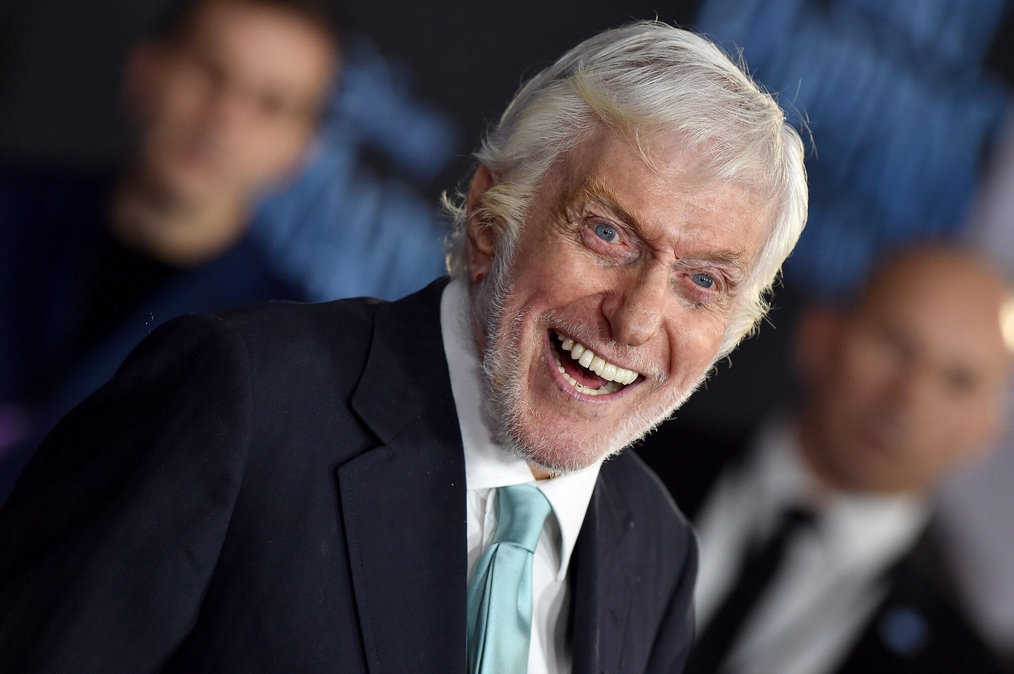 Dick Van Dyke smiles while looking at the camera