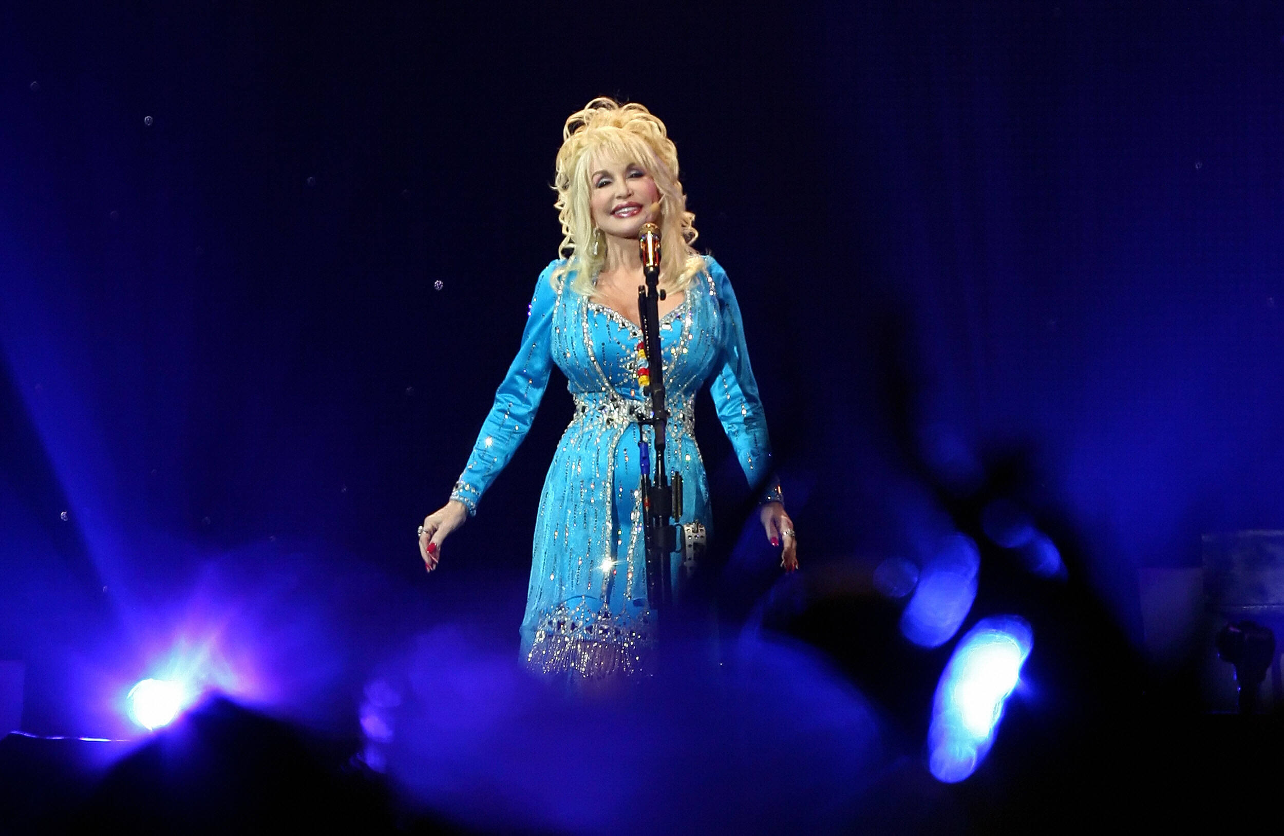 Dolly Parton performs onstage in London as part of her 'Backwoods Barbie' world tour