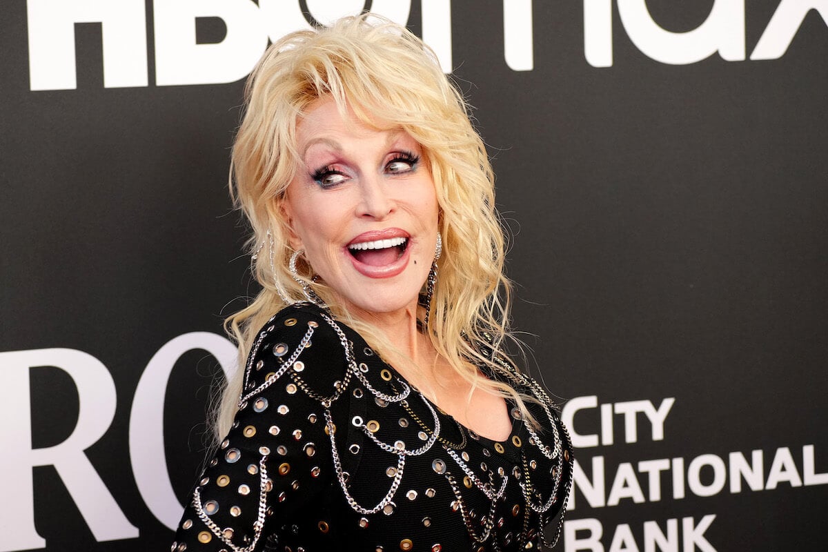 Dolly Parton smiles at an event.