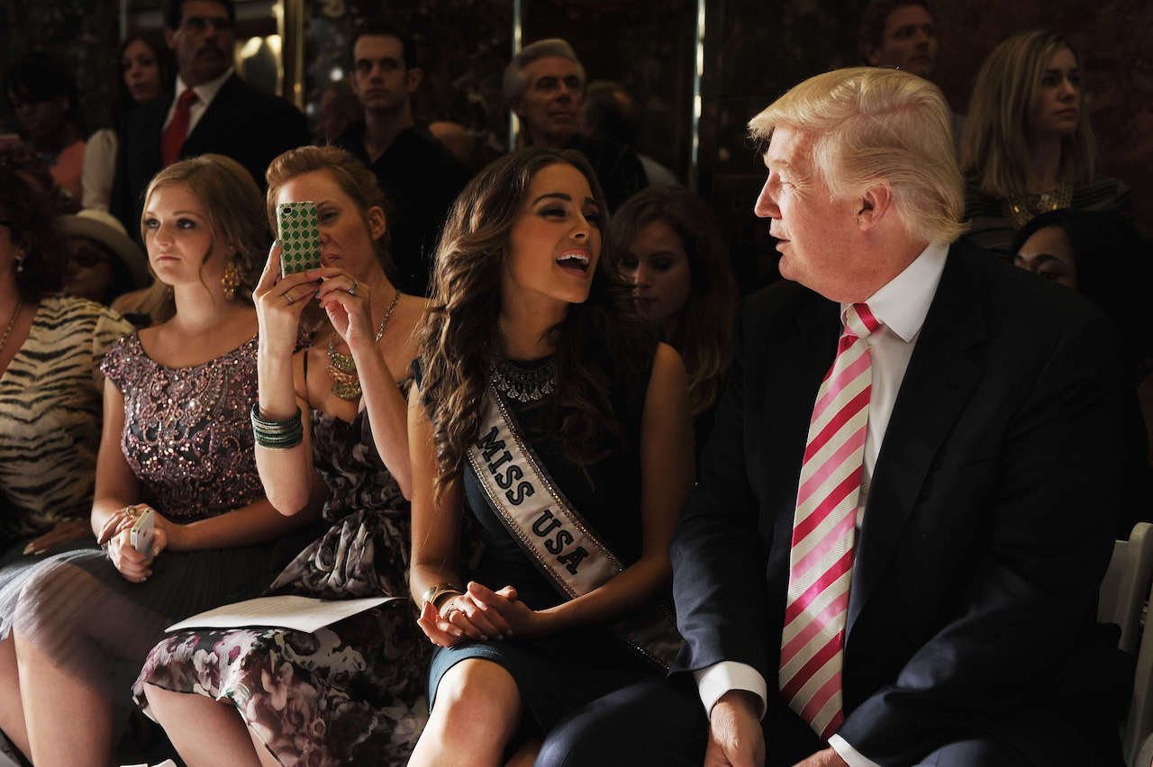 Miss USA 2013 Olivia Culpo and Donald Trump attending the "Evening" Sherri Hill show during Spring 2013 Mercedes-Benz Fashion Week at Trump Tower Grand Corridor on September 7, 2012.
