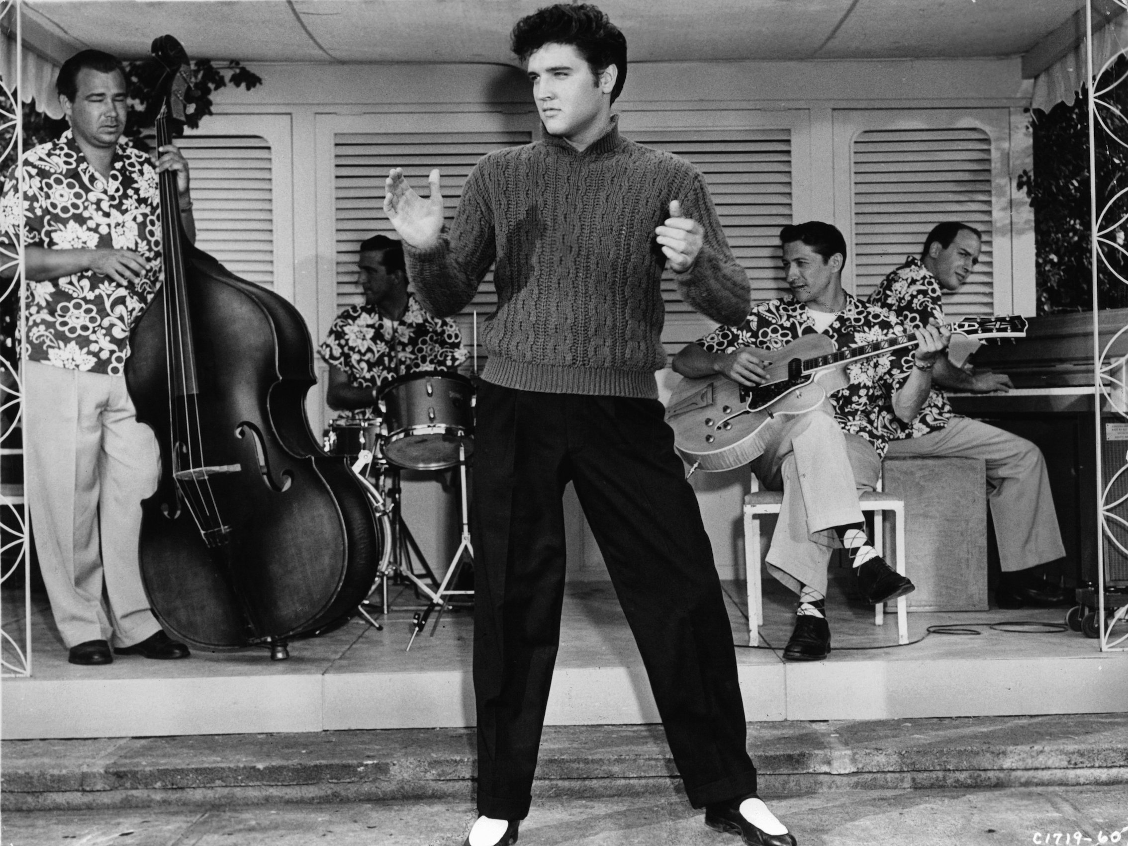 Elvis Presley performing in a scene from the movie 'Jailhouse Rock'