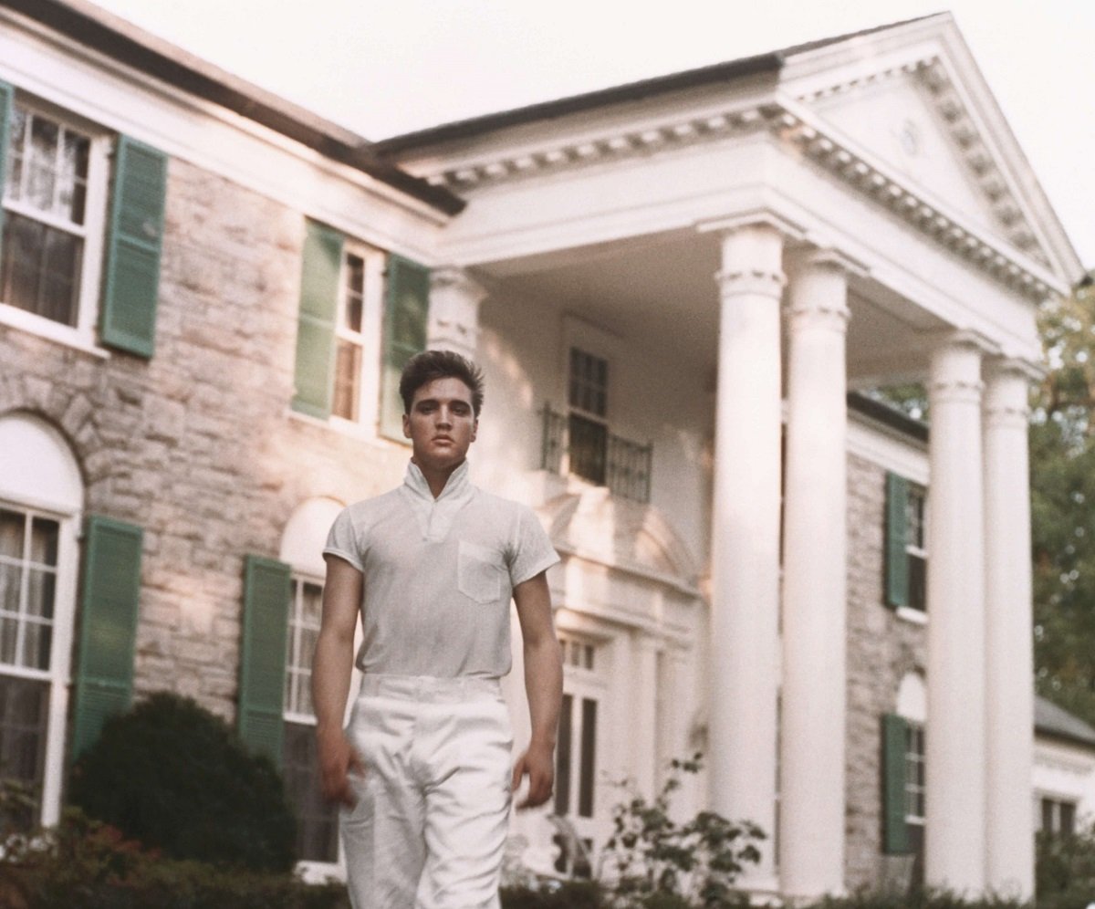 Elvis Presley strolls the grounds of his Graceland estate (circa 1957)