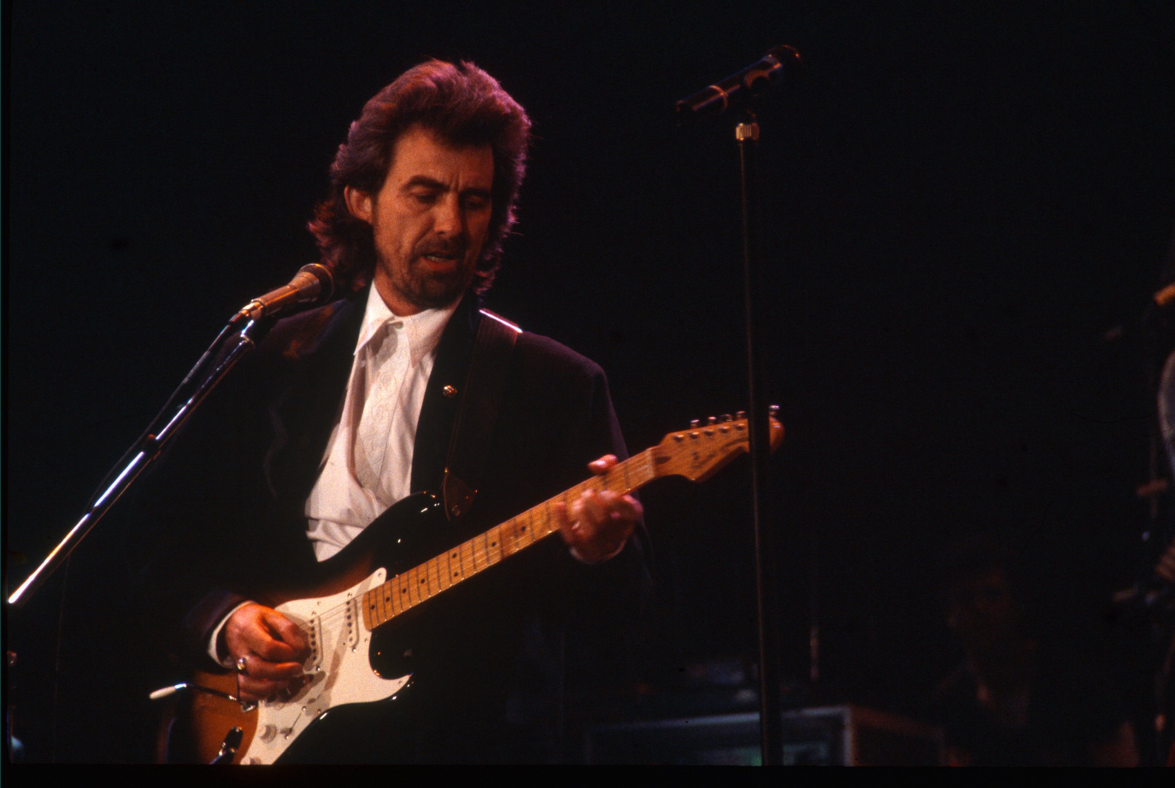 George Harrison performs at Wembley Arena in 1987