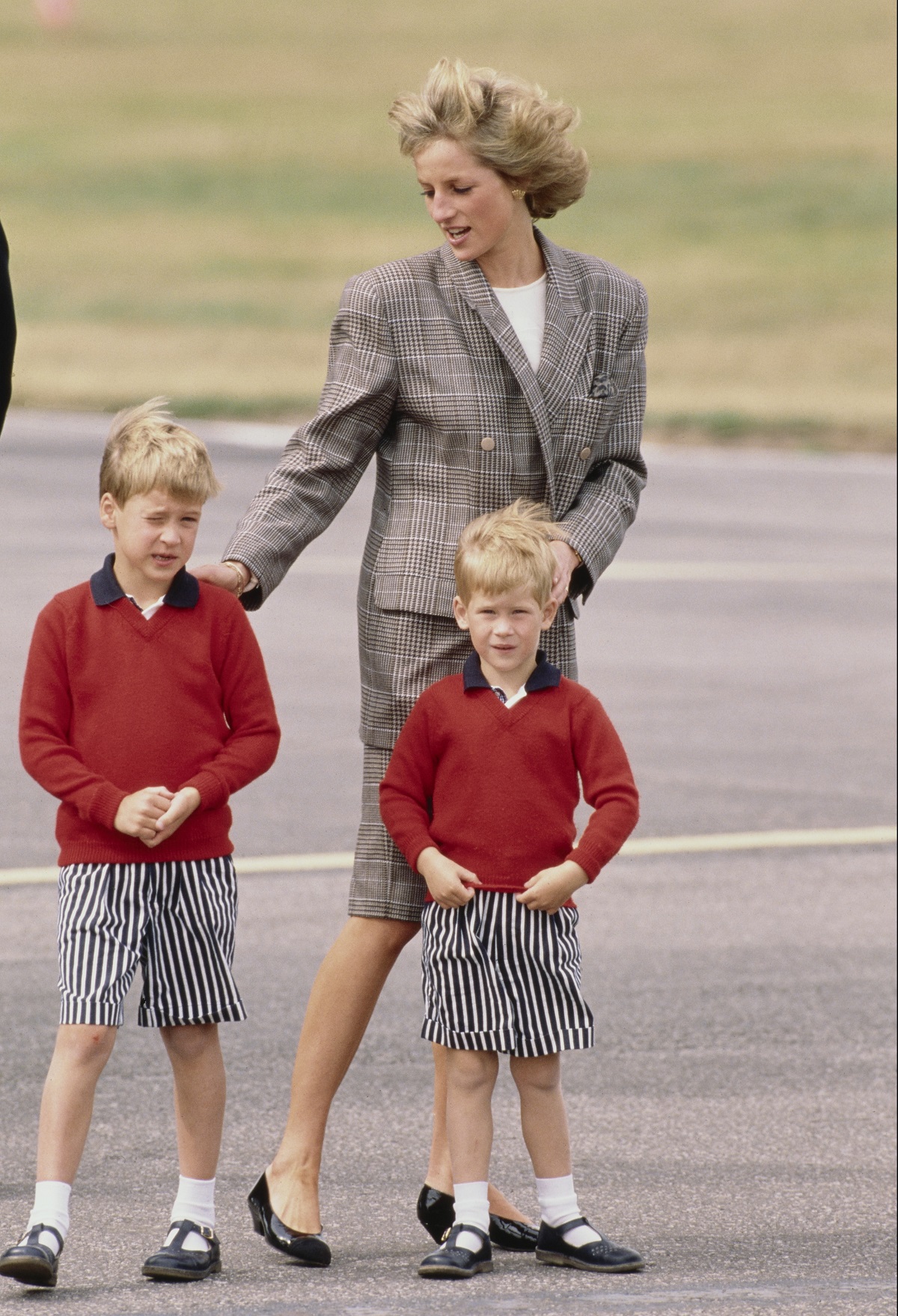 Princess Diana arrives at Aberdeen airport in Scotland with Prince William and Prince Harry in 1989