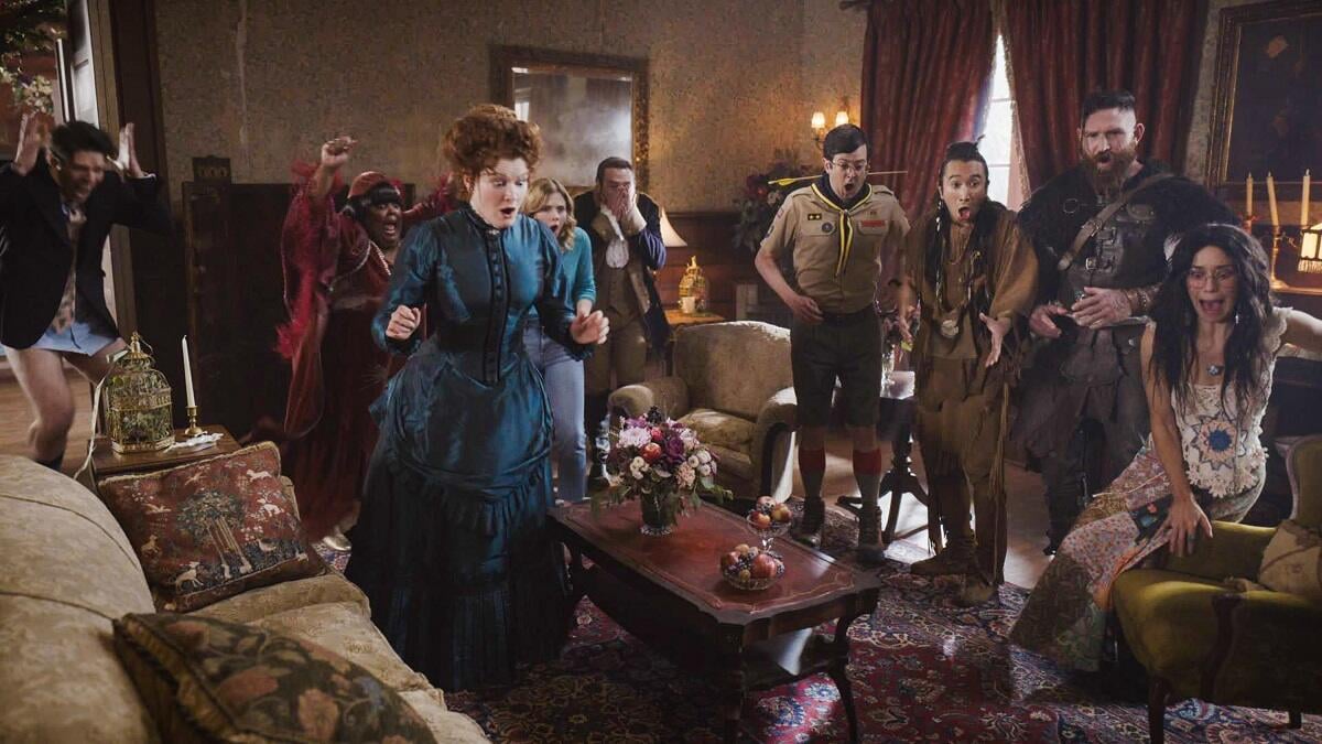 The ghosts of Woodstone Mansion congregate in the living room in an episode of 'Ghosts'