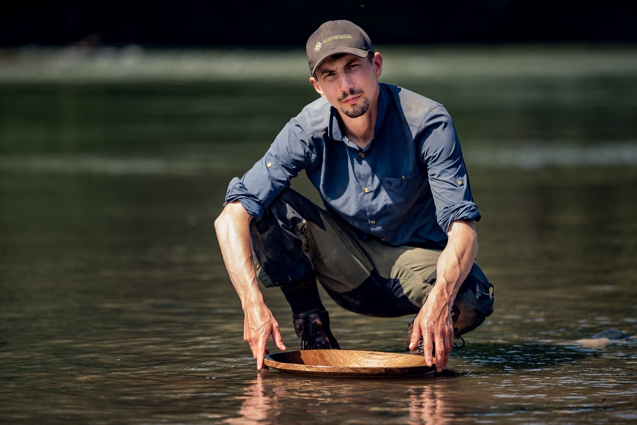 Parke Schnabel panning for gold in the Discovery series 'Gold Rush: Parker's Trail'