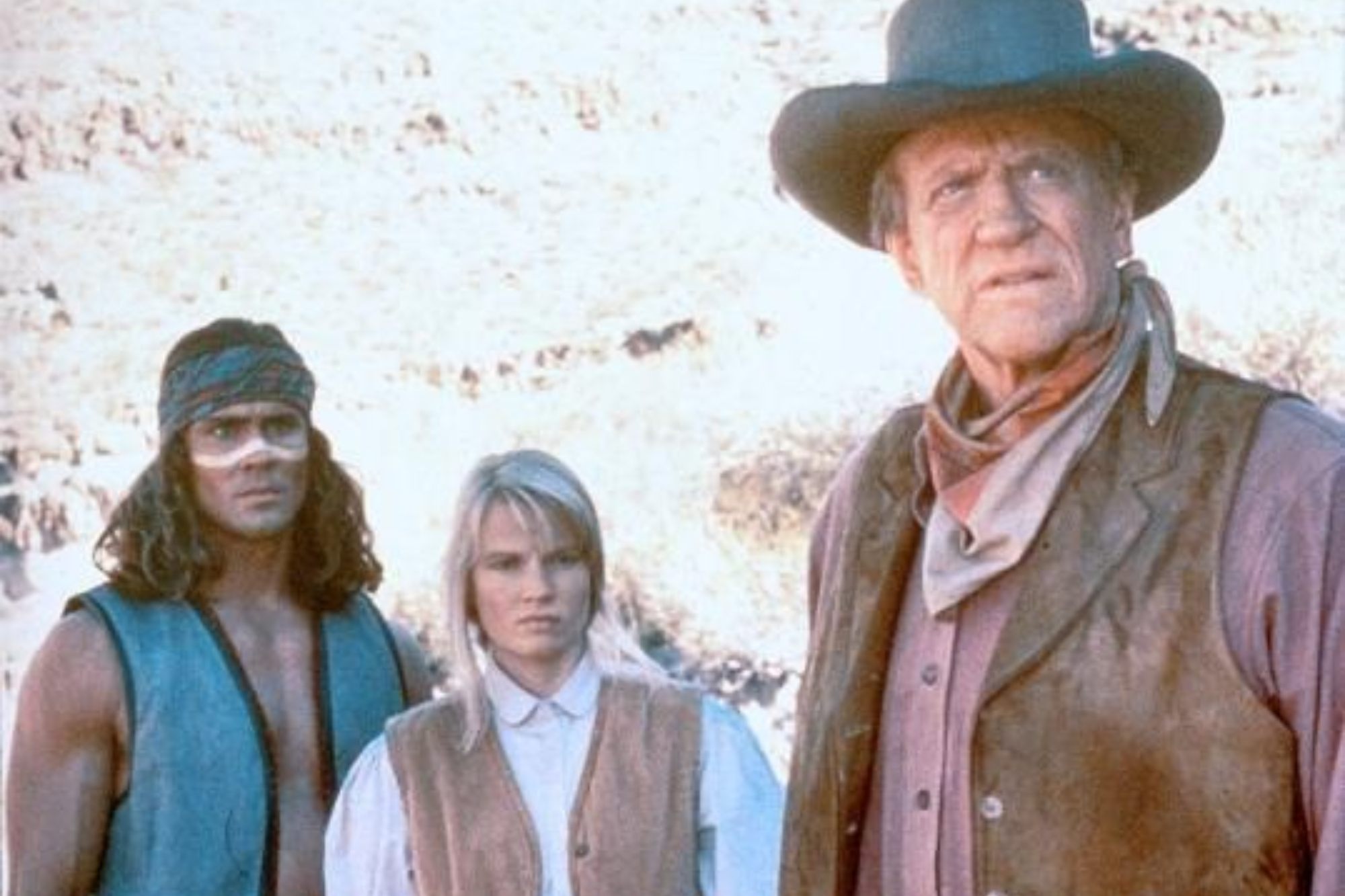 'Gunsmoke: The Last Apache' Joe Lara as Wolf, Amy Stoch as Beth Yardner, James Arness as Matt Dillon looking to the side while wearing Western costumes.