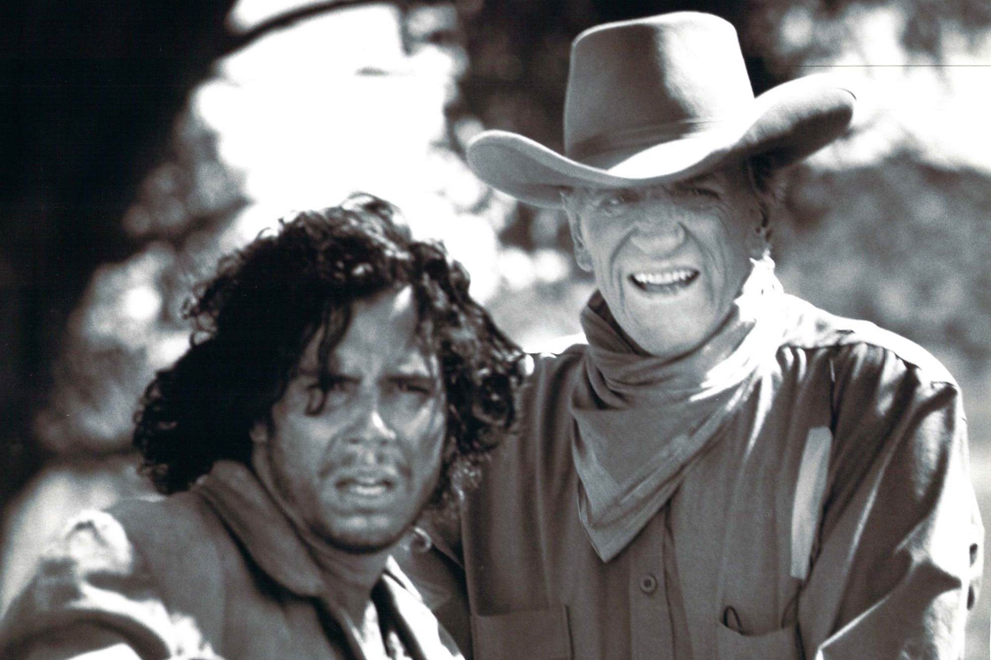 'Gunsmoke: The Long Ride' Marco Sanchez Collie Whitebird and James Arness as Matt Dillon looking at the camera. Sanchez looking panicked and Arness with his mouth open.