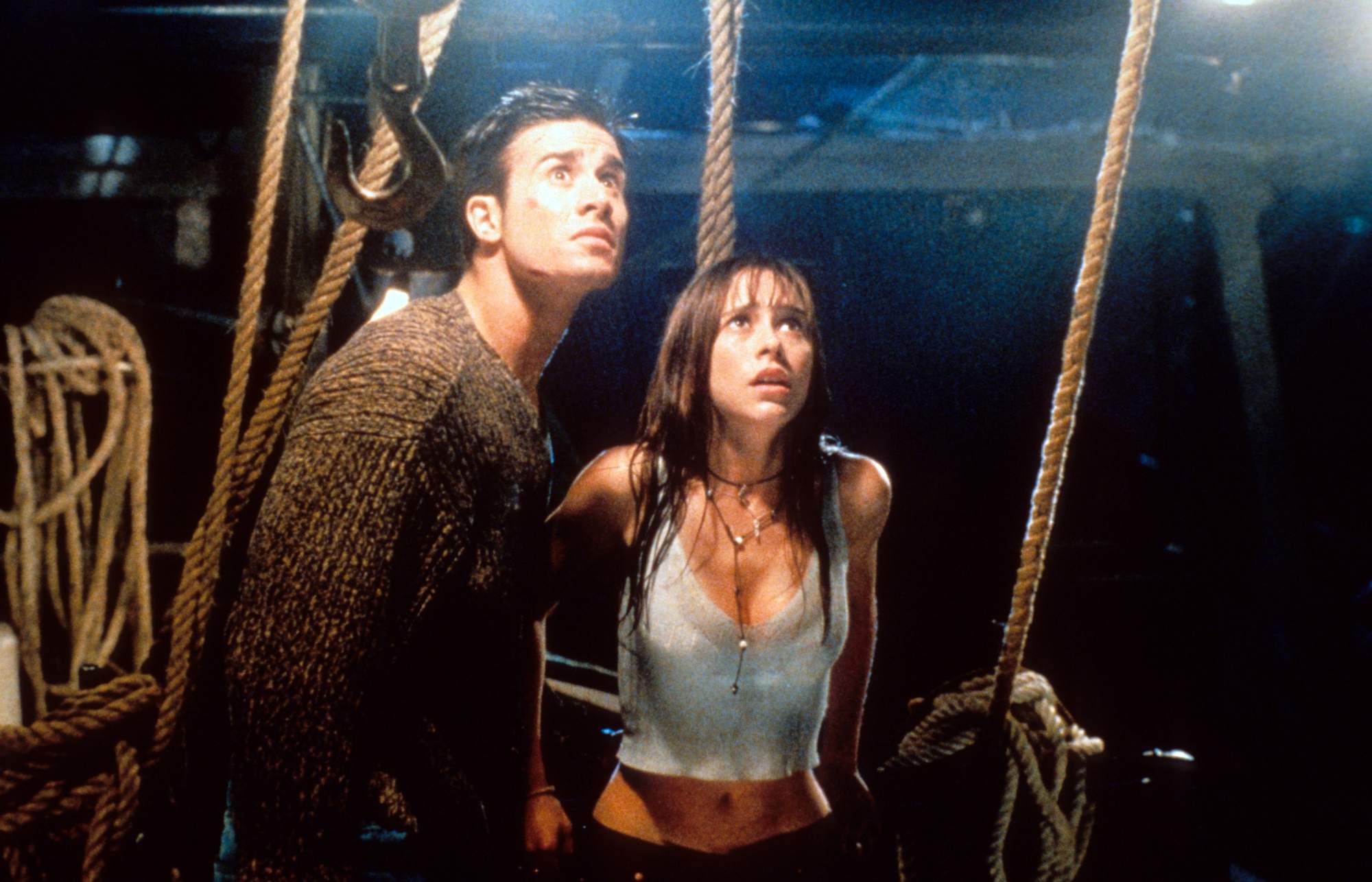 'I Know What You Did Last Summer' Freddie Prinze Jr. as Ray Bronson and Jennifer Love Hewitt as Julie James looking shocked while looking up with ropes behind them.