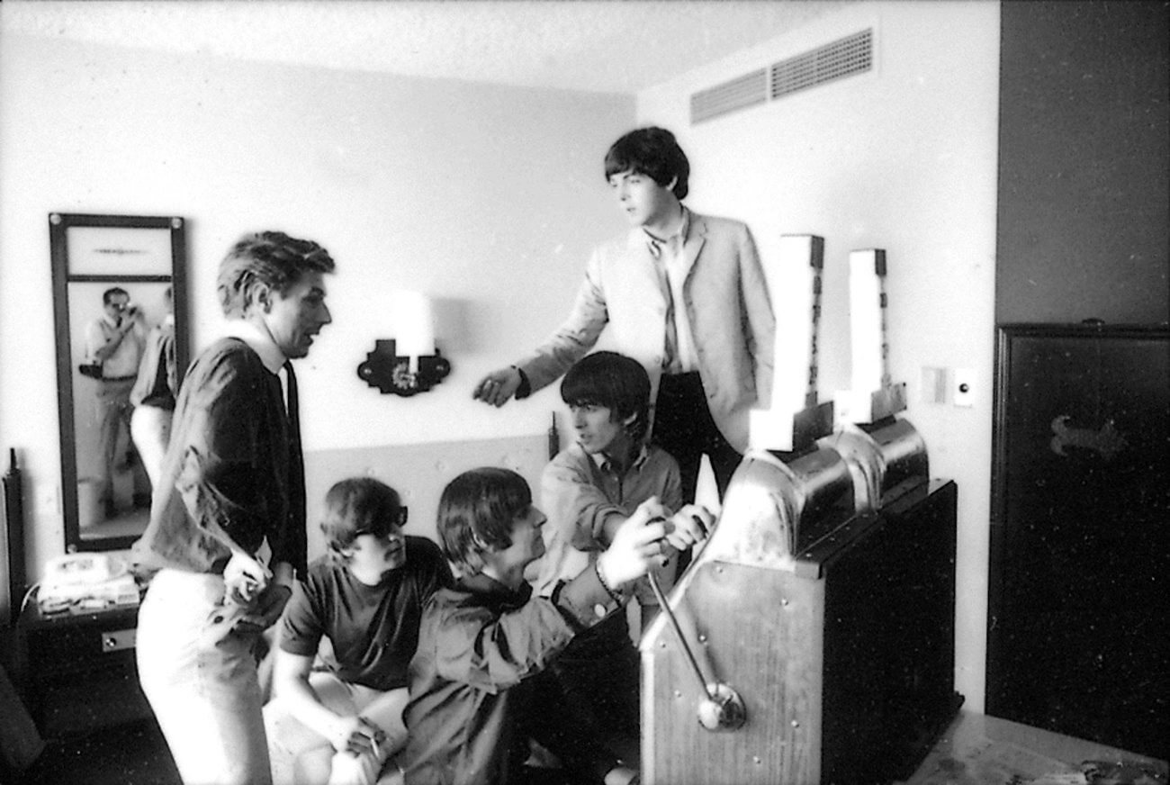 The Beatles with their press agent, Derek Taylor.