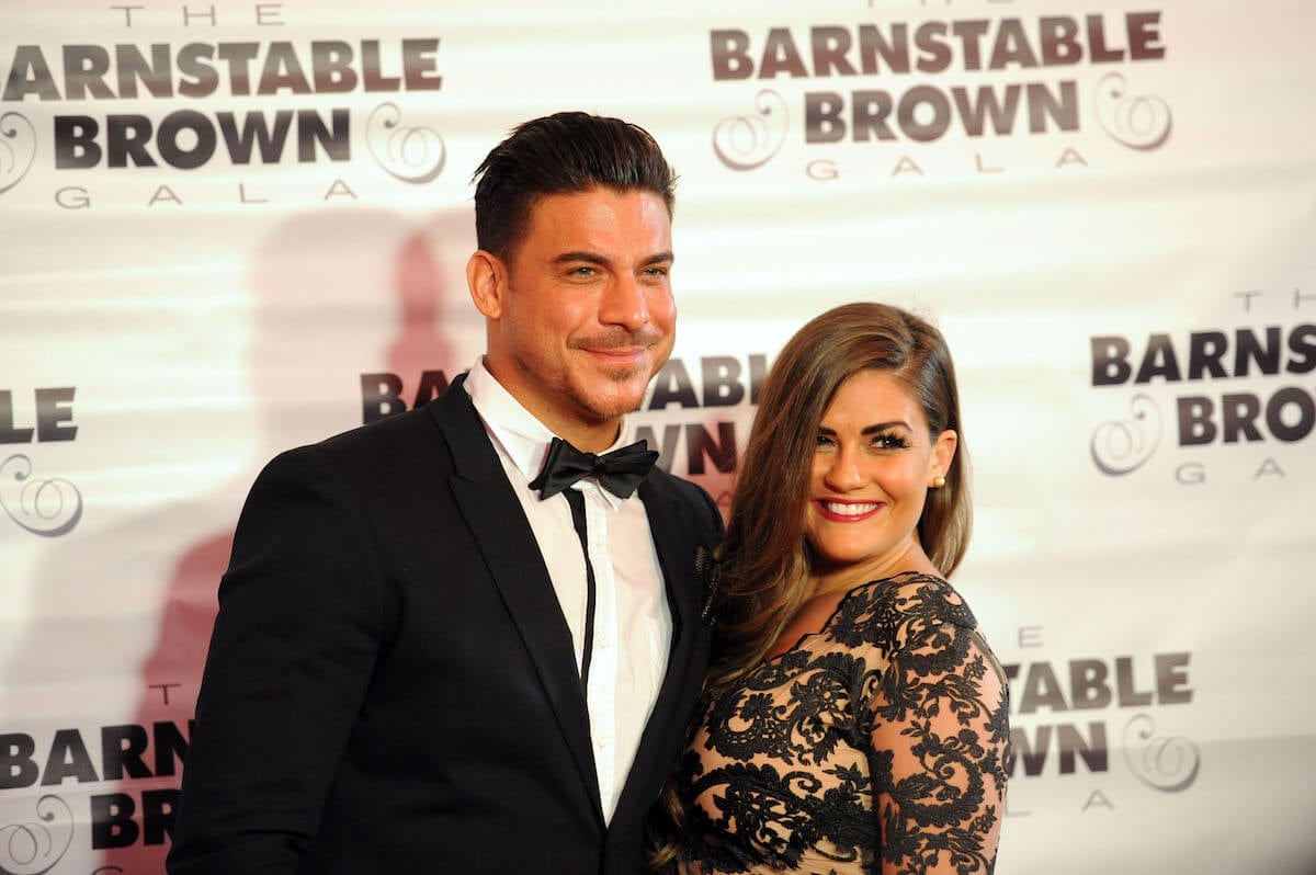 Jax Taylor in a tux with his arm around Brittany Cartwright