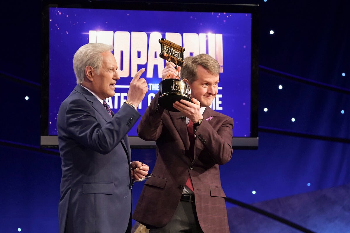 'Jeopardy! The Greatest of All Time': Ken Jennings holds up his trophy with Alex Trebek